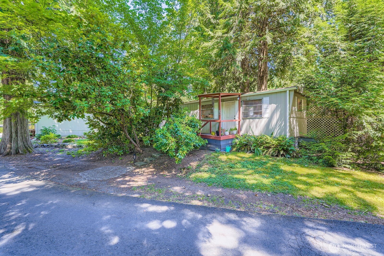 Tucked beneath the trees near Tiger Mountain, this updated home offers peaceful living in one of Issaquah’s most desirable 55+ manufactured home communities. It's smart, cozy space is the perfect fit for someone looking to downsize, simplify, or stay close to loved ones—without giving up independence. Inside, you’ll find tasteful updates and efficient upgrades: a new ductless heat pump ('24) for year-round comfort, a modernized electrical panel, and a new hot water heater ('23). Outside, you’ll love the quiet forest feel, friendly neighbors, and convenient location—minutes to shopping, healthcare, and more! Whether you're seeking a solo sanctuary, a cozy retreat for two, or a home base near loved ones, this one checks all the boxes.