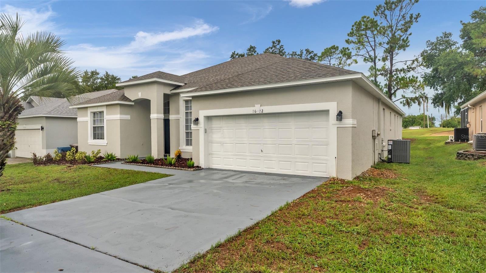 Virtually Staged. Welcome to this beautifully updated 6-bedroom, 3-bathroom pool home offering 2,951 square feet under roof in the highly desirable Southern Dunes Golf & Country Club. Known for its award-winning championship golf course, rolling hills, and resort-style atmosphere, Southern Dunes is one of Central Florida's premier golf communities and is zoned for short-term rentals, making this an exceptional primary residence, vacation home, or Airbnb investment.  From the moment you arrive, you'll appreciate the freshly painted interior and exterior, new roof, and updated landscaping. Inside, the new luxury vinyl plank flooring flows throughout and the large, oversized windows allow in an abundance of natural light.  The spacious kitchen features solid surface countertops, stainless steel appliances, and overlooks the main living areas, making it perfect for entertaining. The private primary suite boasts a beautiful barn door leading to the en suite with dual vanities, a garden tub, separate walk-in shower, and his-and-her walk-in closets.  Step outside to your screen-enclosed pool and unwind while enjoying breathtaking views as the backyard overlooks the Southern Dunes Golf Course. Additional updates include a brand-new air-conditioning system for added comfort and peace of mind.  Whether you're looking for a full-time residence, a vacation getaway, or a high-demand short-term rental opportunity, this move-in-ready home delivers the perfect combination of space, style, and location.  Do not miss your chance to own this 6 Bedroom 3-bathroom home that can hold up to two foursomes comfortably for a golf getaway.  Be sure to schedule your showing today before it's too late!