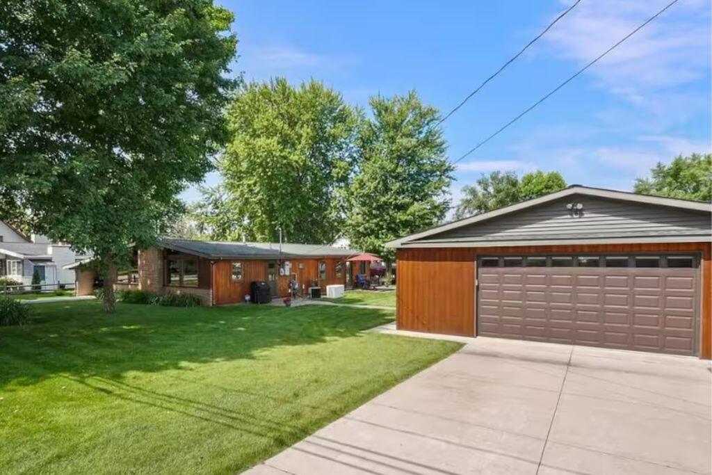 Don't miss your chance to own this charming waterfront canal retreat! This rare offering includes a double lot with 120ft of frontage and features a beautiful stamped concrete patio and matching firepit area. Inside showcases 3 beds/1 bath, vaulted tongue-and-groove knotty pine ceilings and a cozy wood-burning stove in the open concept kitchen-dining-living area. The bathroom is well appointed with custom pine cabinetry, and plenty of storage for towels/toiletries. An addition was added in 2016, adding a spacious living room filled with natural light and waterfront views from every window. Fresh paint & new flooring throughout, newer furnace (2018), water softener, Generac generator w/app-based monitoring, sprinkler system, 5 exterior cameras, a 32x36 insulated and heated garage, with an 8x16 insulated door, Wi-Fi-enabled heat and door, and 220 service. Additional parking under the carport with an attached 12x14 shed.This home is currently used as a STR, can be found on Airbnb and VRBO. Willing to consider a turnkey purchase, terms negotiable. Seller is a licensed agent in the state of Michigan.