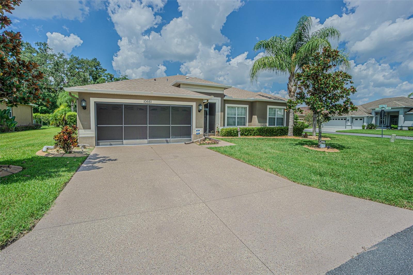 SPECTACULAR NEW LISTING in Clubhouse Preserves is READY for you!  This ONE OWNER home with the Rosewood Grande floorplan, built in 2012 is perfectly situated on a .23 acre, PREMIUM corner homesite in the highly sought-after Tampa Bay Golf & Tennis Club.  Surrounded by mature landscaping and tucked away in quiet seclusion, this 55+ community boasts world-class amenities including two golf courses, a grand clubhouse with restaurant and pub/grille, resort-style pool and spa, fitness center, theater/auditorium, billiard and card rooms, arts and crafts studio, library, lighted tennis and pickleball courts, shuffleboard, dog parks, planned onsite activities and entertainment and offsite trips and excursions!  Great curb appeal with concrete landscape curbing, lush lawn and Screened front entry for cross breezes from Florida room greets you.  Stunning Double leaded-glass front doors welcome you into a spacious foyer with ceramic tile, while luxury vinyl plank flooring extends through the main living areas.  Natural light flows in through solar tubes and added recessed lighting enhances the bright and airy atmosphere.  Gormet kitchen is a favorite and is functional, featuring staggered 42” cabinets, a center island with granite counters, breakfast bar, stainless steel appliances (smooth top range, new microwave 2023), and a spacious breakfast nook overlooking the family room.  Entertaining is effortless with the open formal living and dining combo, plus French doors leading to the extended, enclosed, air-conditioned sunroom with slider windows—perfect for year-round relaxation!  The spacious owners suite is your private retreat... situated at the rear of the home with access to Sunroom and bath ensuite boasting dual sinks, water closet, soaking tub plus separate shower, large walk in closet and linen closet.  Flexible den/office with double doors off foyer provides extra space to suit your lifestyle as a home office/den or flex room.  Secondary guest bedroom and bath are on a separate wing for privacy at the front of the home for privacy. Additional highlights include: Separate interior laundry room with washer & dryer, Screened 2-car garage with attic access & metal shelving, Faux wood blinds throughout, 8x8 backyard grilling pad.  Upgraded lighting & sprinkler system with new control panel, water softener leased by Blair water systems and the big updates are DONE for you: NEW ROOF (2024), AC (2020), plus appliances updated as recently as 2023.  This beautifully maintained 2311 square foot home is ready for its new owners to enjoy the resort lifestyle that Tampa Bay Golf & Tennis Club is known for... to live like you’re on vacation every day!  Located North of Tampa for easy access to Wesley Chapel, Orlando, Shopping, restaurants, major highways for easy commute to airports and the Beaches!  CALL TODAY!