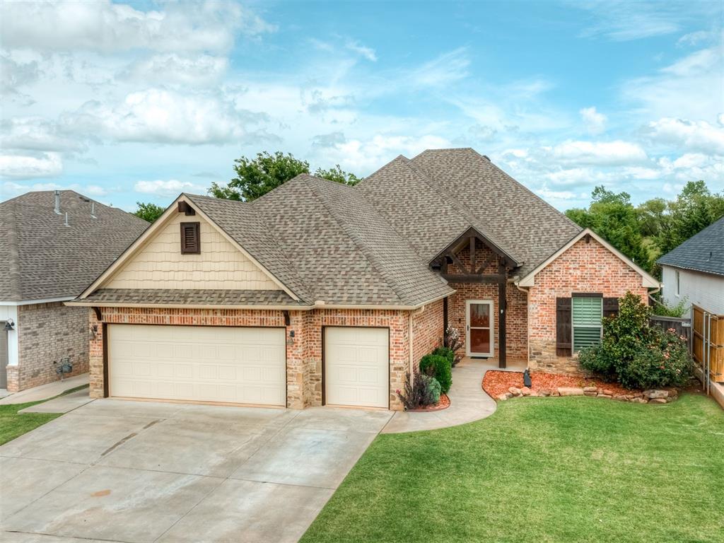 Welcome to this beautifully appointed 3-bedroom, 2.5-bath home with a versatile pocket office, over 2,000 square feet of thoughtfully designed living space, & an incredible outdoor living space in the highly desirable Vintage Creek community. With its grand curb appeal & private setting backing to open land, this home offers a rare combination of elegance, comfort, & privacy. Step inside to an inviting open-concept floor plan featuring rich hardwood floors, striking wood ceiling beams, plantation shutters, quality wood baseboards, & crown molding throughout. The chef's kitchen is designed to impress with a large leathered granite island, granite countertops, stainless steel appliances, abundant custom cabinetry with pull-out wood drawers, & an oversized walk-in pantry.  The generous dining area easily accommodates a large table & features a convenient serving window that opens directly to the patio. The luxurious primary suite is a true retreat with hardwood floors, a sliding barn door, & a spa-inspired ensuite featuring dual vanities, a relaxing soaking tub, a beautifully tiled walk-in shower, & an expansive walk-in closet complete with a built-in dresser. The secondary bedrooms are thoughtfully located on the opposite side of the home, with one bedroom featuring a built-in storm shelter/safe room integrated into the closet. Additional premium features include a central vacuum system, built-in surround speakers in the living room, sprinkler system, & an impressive mudroom with extensive built-in cabinetry providing exceptional storage. Step outside to your own private backyard oasis. The expansive covered patio showcases a soaring cathedral ceiling & peaceful views of the private land behind the home. The fully equipped outdoor kitchen, features a built-in gas grill & flat-top grill. As a resident of Vintage Creek, you'll enjoy outstanding neighborhood amenities including a community swimming pool, clubhouse, scenic fishing ponds, & walking trails.