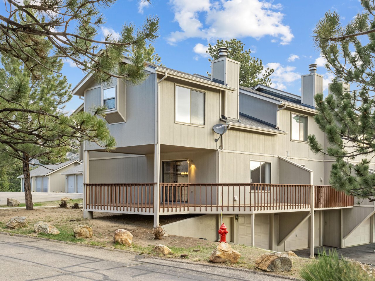Where mountain living meets everyday comfort-and where the very best of Estes Park comes together in one of the most desirable locations on Big Horn. Offered for the first time in generations, this end-unit Lewiston condo is a rare opportunity to own a piece of Estes Park in a setting that truly delivers. From the moment you step inside, you'll appreciate the functional main-level layout-perfectly designed for both quiet evenings at home and effortless gatherings with friends and family. Natural light pours in, with mountain views framed beautifully from nearly every window. The true standout? The generous deck-an extension of your living space and the place you'll find yourself drawn to again and again. Whether it's morning coffee surrounded by fresh mountain air or unwinding at sunset as the sky lights up over the peaks, this is where the Estes Park lifestyle comes to life. Location is everything, and this one checks every box. Just minutes from downtown Estes Park, you're an easy walk or quick drive to restaurants, shops, and year-round events. Outdoor enthusiasts will love the easy access to Rocky Mountain National Park and the nearby Lumpy Ridge trail system-putting world-class hiking, climbing, and wildlife right out your door. Whether you're searching for your first home, a mountain getaway, or something in between, this is a place that simply feels right. Come experience it for yourself-and see if 321 Big Horn #E6 is calling you home.