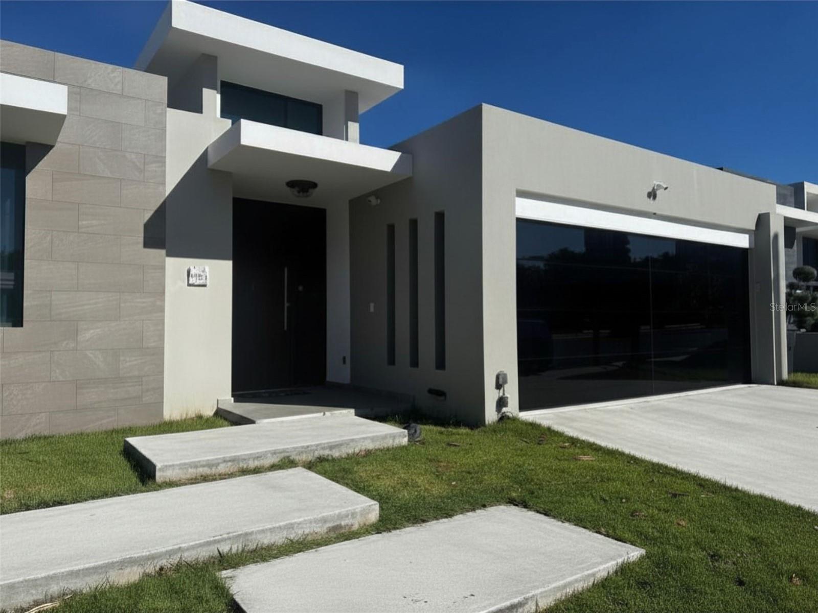 Home in Las Casonas de Guaynabo featuring a modern, open-concept design, high ceilings, and bright, airy living spaces. The layout promotes seamless flow for entertaining and daily living, while the closets are left with empty interiors so you can tailor storage to your taste. The property offers an easy generator connection setup for reliable power, and the terrace is terrace-ready for a future vineyard or stylish outdoor retreat. Located in a prime area of Las Casonas de Guaynabo with convenient access to amenities and major routes, this home blends contemporary living with customizable details you can perfect to suit your lifestyle.