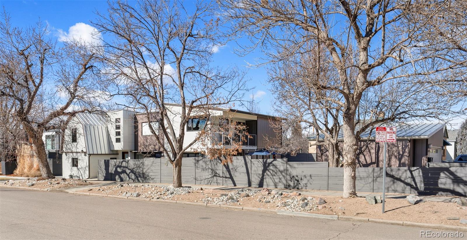 Welcome to one of Platt Park’s most distinctive residences, an artfully designed home that blends modern architecture, curated luxury finishes, and an outdoor sanctuary rarely found in the city. Perfectly positioned just two blocks from Pearl Street and the beloved Sunday Farmers Market, this is a lifestyle opportunity where Denver’s best dining, cafés, and boutiques are truly at your doorstep—including the iconic Sushi Den. Originally artist-designed and built in 2011, this extraordinary home was thoughtfully remodeled in 2020, elevating it with refined materials and bespoke details throughout. Step inside to a dramatic 20-foot great room ceiling that floods the space with light and volume, complemented by mahogany interior doors, custom railings, radiant floor heating, and whole-house water filtration. The fully reimagined chef’s kitchen is both stunning and functional, featuring custom cabinetry, a Calcutta honed marble island, and an impressive suite of professional appliances including a 48-inch Sub-Zero Pro refrigerator, Viking Pro range, Vent-A-Hood hood, Kohler Prolific sink, Dornbracht faucet, Ann Sacks tile, and custom lighting fixtures. A stylish bar area with Perlick beverage refrigerator makes entertaining effortless off the dining room to outdoor sanctuary. Wide-plank French Oak wood flooring flows throughout the entire home. Energy-efficiency is a central theme with brand new Bosch European mini-split AC units for maximum cooling with in-floor radiant heat to provide year-round comfort. Outdoors, the property unfolds into a private Zen-inspired retreat—a true rarity in the city with southwest exposure. Enjoy sculptural water features, board-formed concrete garden walls, manicured landscaping, a fire pit gathering area, and a magical outdoor dining area with patio designed for unforgettable evenings under the Colorado sky. The setting spans an extraordinary half-city-block footprint, creating both privacy and presence. A MUST SEE residence!