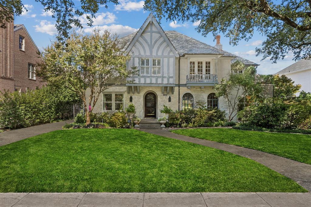 Set on one of Highland Park’s most beloved streets, this 1928 Tudor blends historic character with modern luxury. Behind its classic brick façade and beneath a canopy of stately trees, the home offers a perfect balance of old-world charm and contemporary updates.
The beautifully remodeled interior features four spacious bedrooms, a light-filled sunroom, and gracious living areas highlighted by original architectural details. The large, open family room offers an inviting fireplace and double doors that open to the pool and patio—perfect for effortless indoor-outdoor living and entertaining. The brightly updated kitchen is outfiitted with marble sink, countertops and top of the line stainless appliances. Upstairs, the primary suite is oversized with a sitting area that opens to a balcony nestled among the treetops. 
Outdoors, enjoy resort-style living with a sparkling pool, lush mature landscaping, and multiple entertaining spaces. A large guesthouse provides ideal accommodations for visitors or flexible use as a home office or studio. Completing the property are a rare three-car garage and thoughtfully designed grounds that ensure both privacy and elegance.
This is a rare opportunity to own a piece of Highland Park history—where timeless design meets modern comfort.