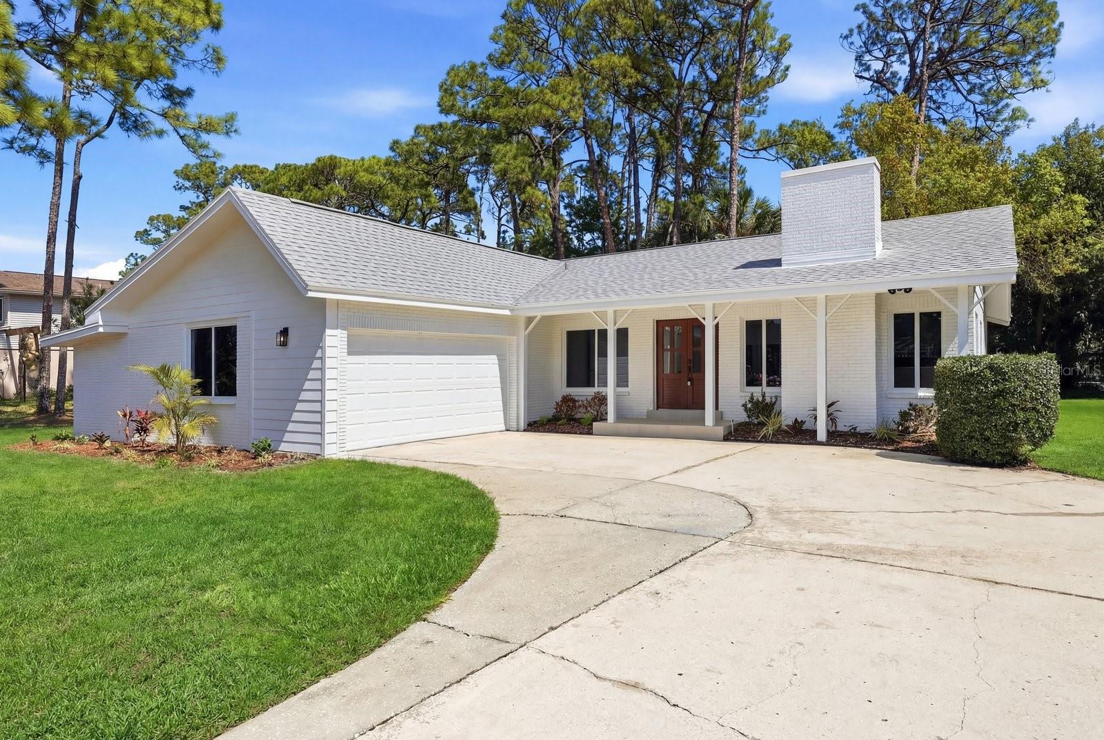 One or more photo(s) has been virtually staged. Welcome to this beautifully renovated 3-bedroom, 2-bath home offering 1,716 square feet in the highly desirable Feather Sound community. Thoughtfully updated throughout, this home features a new roof, new HVAC system, porcelain tile flooring, and a completely redesigned kitchen with new cabinetry, quartz countertops, and brand-new appliances.  All new hurricane rated windows throughout. The open-concept floor plan creates a bright and inviting living space centered around a charming fireplace, perfect for relaxing or entertaining. The spacious primary suite offers a peaceful retreat with a luxurious bathroom featuring a separate soaking tub and shower.Step outside to enjoy the private patio, ideal for morning coffee or evening gatherings. Additional highlights include a side-entry garage and tasteful modern finishes throughout.This home’s location offers exceptional convenience with easy access to St. Petersburg, Clearwater, Safety Harbor, and Tampa International Airport. Everyday amenities including restaurants, grocery stores, fitness centers, medical offices, and entertainment like Top Golf plus all the shopping and venues of downtown St. Petersburg are all just minutes away.Move-in ready and perfectly located, this charming Feather Sound home offers the ideal combination of modern upgrades, comfortable living, and everyday convenience.