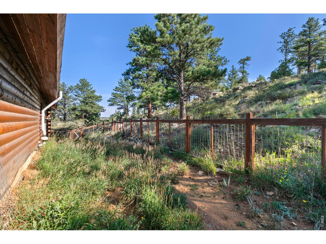 Come experience the magic of mountain living-where every window is a picture frame, and every day begins with a view. Nestled on approximately 2.6 acres of scenic land, this stunning mountain home offers a front-row seat to nature's grandeur. The home has it's own high producing water well, an electric vehicle charger in the garage, and a brand new roof with Class IV impact resistant shingles. From nearly every room, you'll enjoy sweeping views of the surrounding peaks, forested hillsides, and vibrant Colorado skies. Whether you're sipping coffee on the expansive wraparound Trex deck or watching the sunset from the comfort of your primary suite, the vistas here are nothing short of spectacular. Spanning approximately 3,683 square feet, this four-bedroom, two-bathroom home combines rustic charm with modern comfort. Vaulted ceilings and large windows flood the interior with natural light, perfectly framing the ever-changing mountain landscape. Hardwood floors and three cozy gas fireplaces add warmth and character, while the spacious kitchen-complete with stainless steel appliances, granite countertops, and a butler's pantry-makes entertaining a joy. The primary bedroom is a true sanctuary, offering direct deck access and panoramic views that make every morning feel like a getaway. A charming library/office provides a peaceful space to work or unwind, while the oversized family room is ideal for gatherings. The walk-out basement and additional bedrooms offer flexibility for guests or multi-generational living. Outside, the covered porch and generous outdoor space invite you to relax, explore, and soak in the tranquil beauty of Glacier View Meadows. Just 35 minutes from the vibrant energy of Old Town Fort Collins, this home offers the perfect balance of seclusion and convenience.