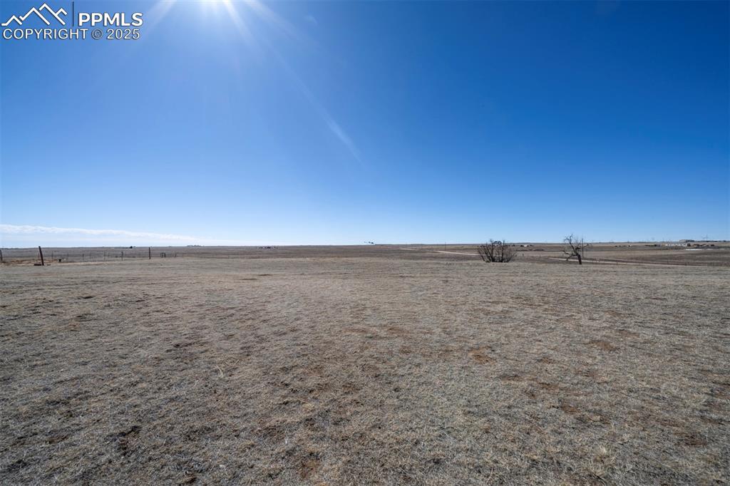 Picturesque vacant lot spanning approximately 44.85 acres with gently rolling terrain and open spaces that offer panoramic views of the mountains and Colorado plains. This expansive property offers a serene and private setting, ideal for those seeking a tranquil lifestyle away from the city. This lot is already fenced with three separate sections to protect your animals and livestock. A well permit has been issued and a well with casing has been dug. All you need to do is to install a pump. This vast acreage presents numerous possibilities, from establishing a new agricultural venture to developing a functional ranch or farm. Situated about a mile off Judge Orr Road in Calhan, the land provides both seclusion and accessibility. Located in El Paso County, Calhan is known for its rural charm and close-knot community. The property is within reasonable distance to all the amenities of larger cities, providing a perfect balance between country living/working and urban convenience. Don't miss this opportunity to own a substantial piece of Colorado's scenic landscape.