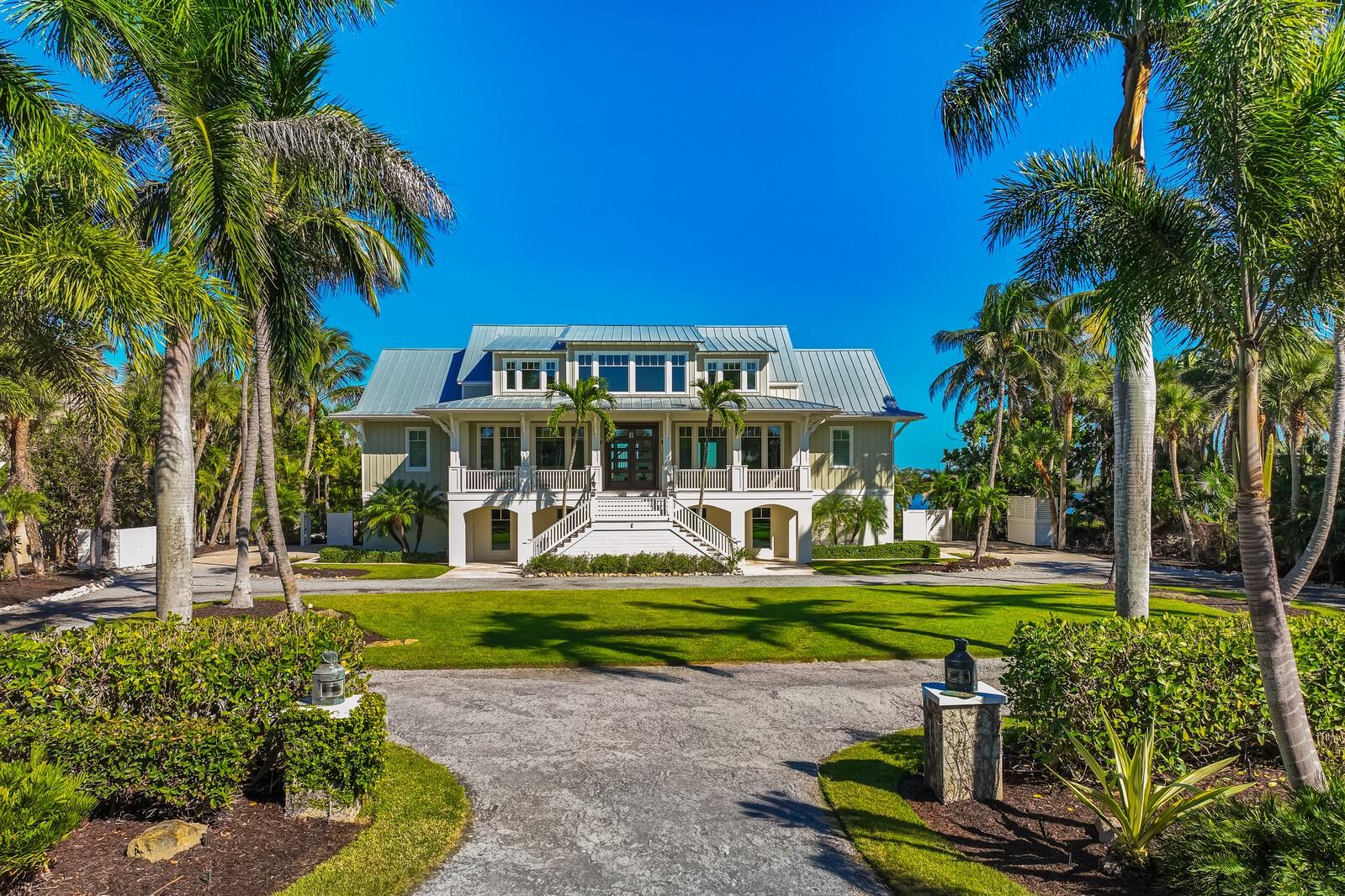 Nestled on a rare 1.6-acre waterfront parcel with views of Gasparilla Sound is a coastal masterpiece that has just undergone a complete, top-to-bottom remodel by PCI, embracing a serene coastal theme with light, airy colors throughout. Conveniently located on Loomis Avenue, just moments from the charming shops, restaurants, and amenities of historic downtown Boca Grande, this exquisite estate offers tranquility with sweeping breathtaking unobstructed water views. Boasting an impressive 159 feet of prime waterfront, the property features 4 spacious bedrooms, a versatile flex den room, 4.5 luxurious baths, and multiple inviting living areas designed for seamless flow and relaxation. The chef’s dream kitchen is outfitted with premium Wolf brand appliances, perfect for culinary enthusiasts. Convenience abounds with laundry facilities on both the lower and top floors. Step outside to one of the largest pools on Boca Grande, ideal for lavish gatherings, complemented by a grand main-floor patio area and a private master suite balcony on the top floor—both perfect for entertaining guests in style. The estate includes a massive 5-6 car garage with convenient side-entry doors, ample parking via an elegant circle drive, hurricane-rated windows and doors for peace of mind, and a private elevator for effortless access between levels. An open floor plan enhances the home’s light-filled ambiance, while mature, lush landscaping envelops the grounds in tropical serenity. This is more than a home—it’s a slice of paradise, where luxury meets the laid-back charm of island living, all just a short stroll or bike ride from town.