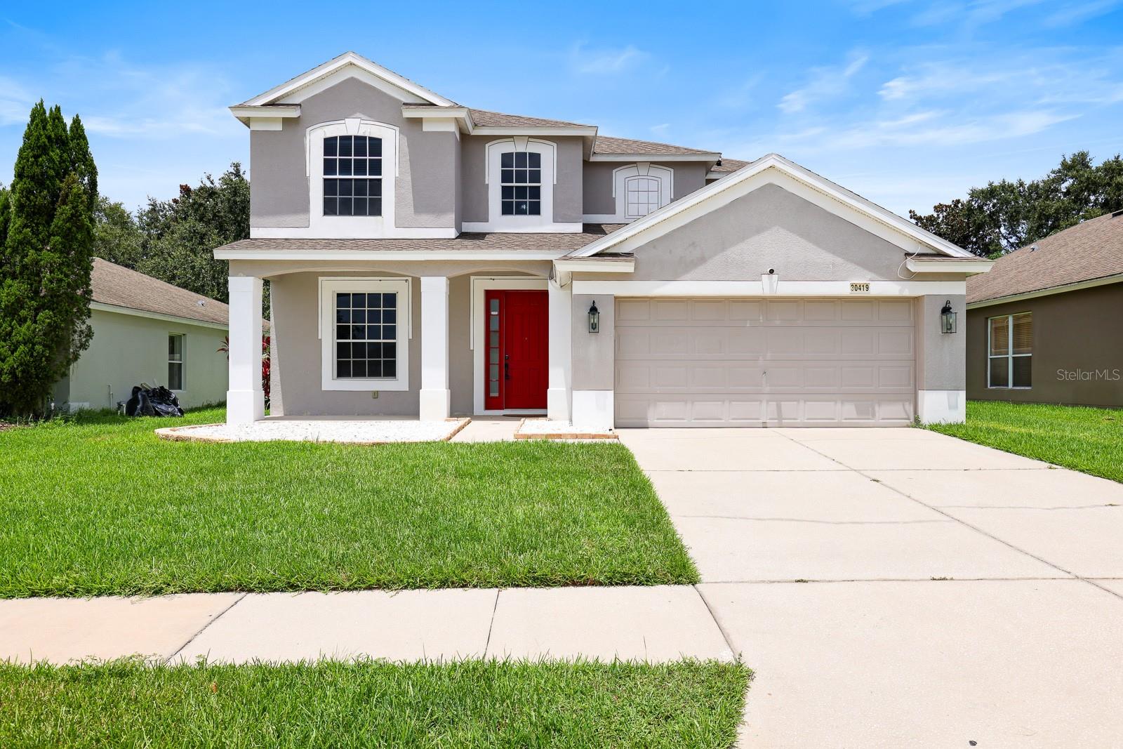 *Subject to Existing Lease. Lease Expires 1/14/2027* Welcome to this beautifully maintained 4-bedroom, 3.5-bathroom home located in the sought-after Palm Cove community of Wesley Chapel. Offering 2,501 square feet of well-designed living space, this residence combines comfort, functionality, and style in a highly desirable location. As you step inside, you’re greeted by a spacious formal living and dining room combination, complete with elegant porcelain tile flooring and an abundance of natural light—perfect for entertaining or enjoying a peaceful evening at home.Toward the back of the home, an expansive open-concept layout seamlessly connects the kitchen, dinette, and family room. The kitchen is thoughtfully equipped with ceramic tile flooring, a large center island, two pantry closets, and a full appliance package including a range, refrigerator, dishwasher, and microwave. The adjacent dinette offers a cozy spot for casual meals, while the spacious family room provides the ideal gathering place for relaxation and connection.Step outside to a screened-in back patio overlooking a fully fenced backyard—perfect for outdoor dining, play, or simply enjoying the Florida weather in privacy. Upstairs, the luxurious primary suite features a double-door entry, two walk-in closets, and a well-appointed en-suite bathroom with a soaking tub, separate walk-in shower, dual sink vanity, and private water closet. The remaining three bedrooms are also located on the second floor. Two share access to a full hall bathroom, while the third enjoys its own private en-suite—ideal for guests or multi-generational living. All bedrooms feature plush carpeting for added comfort. Additional highlights include a 2-car garage and a flexible, light-filled layout to suit a variety of lifestyles. Residents of Palm Cove enjoy access to community amenities including a resort-style pool, park, and playground—enhancing the appeal of this already impressive home. With easy access to I-75, commuting is a breeze, and you’re just minutes from a wide range of shopping and dining options—less than 8 miles to The Shops at Wiregrass and under 9 miles to the Tampa Premium Outlets.
