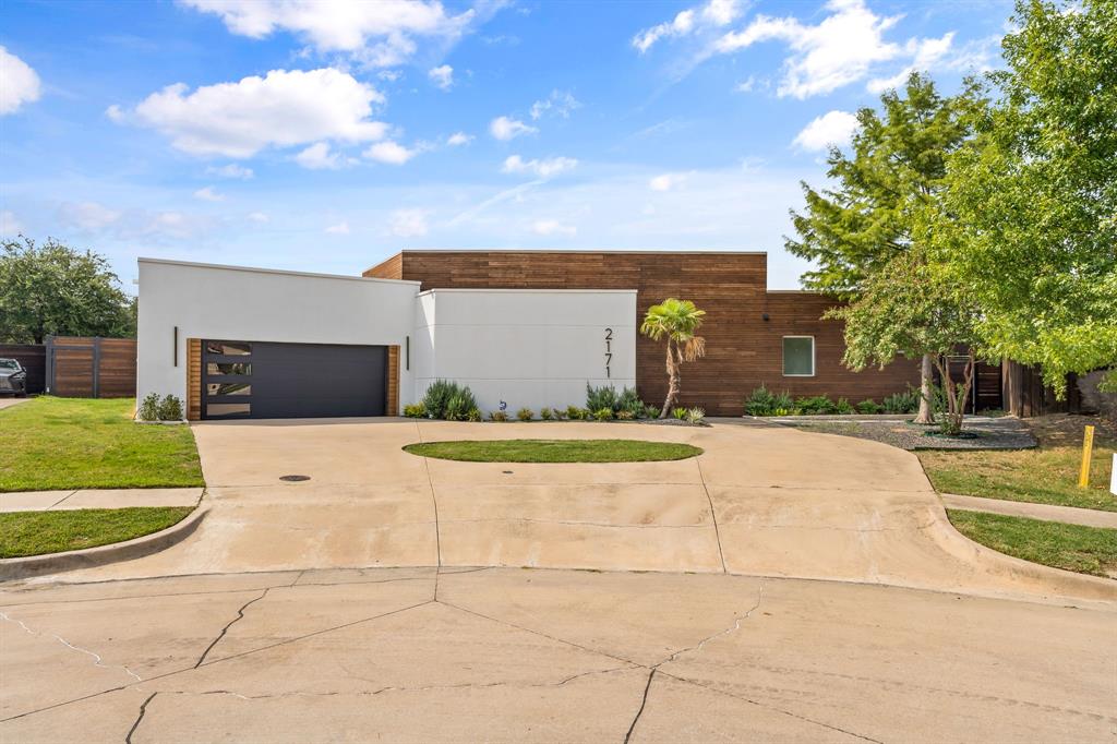 PREPARE TO BE AWED. Contemporary Bauhaus Designed One-Story Green Estate in the Exclusive Guarded AND Gated community of Cottonwood Valley. This superior locality features an entire array of custom designed homes situated within 10 minutes of DFW airport and offers it's own private golf course to esteemed residents. Situated on a half-acre, the exterior is constructed of high-grade concrete for maximum energy efficiency. Step into this open concept beauty noting vaulted ceilings , modern recessed lighting and polished natural hardwood floors throughout. Designer modern color scheme showcasing oversized door frames adding to the flow of the home. Marble wall tiles in bathrooms. High-end sliding glass doors viewing the salt water pool and covered patio. Entertain your friends with a game on YOUR OWN PRIVATE PICKLEBALL COURT! Flat-panel custom cabinetry in the kitchen with a colossal quartz island to prepare all your meals. Three car garage with polished epoxy flooring to store all your adult toys. This property has been engineered from the studs with every detail placed for modern comfort and function. THE PROPERTY MUST BE WALKED TO EXPERIENCE THE CONCEPTUALIZED BEAUTY. Showings to begin on September 21st.