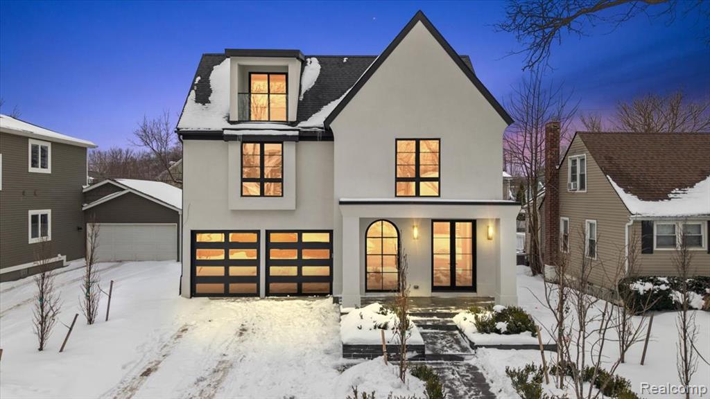 Dreamy Modern Tudor Built by AG Design in 2025 - this striking modern Tudor boasts sleek design, high-end finishes, and exquisite decor. Stunning curb appeal sets the stage for what lies within. Step into the foyer, where elegant, checkered marble floors lead to a stylish library/office with custom wall details. The open-concept living area is designed for both comfort and sophistication. A show stopping island kitchen features black cabinetry, sleek marble countertops, and fluted hood. The living room is anchored by a beautiful fireplace, custom built-in arched wet bar, and a door wall opening to the backyard patio. The adjacent dining area with an inset wet bar seamlessly connects to the kitchen and living space. A convenient mudroom off the garage of the home provides easy access to your attached 2 car garage offering ample storage. Upstairs, the luxurious primary suite is a true retreat with two spacious walk-in closets, and a stunning ensuite bathroom featuring beautiful flooring, an oversized Euroglass shower, a stylish tiled wall, a double vanity, and a tub with a ceiling filler. Of the 3 additional bedrooms 2 share a well-appointed full bathroom, and the third is a ensuite bath, while the second-floor laundry adds everyday convenience. The third floor offers additional flex space, with a balcony, and a full bathroom perfect for a private lounge, home office, or entertainment area. The finished basement expands the home's versatility with a large recreation area, a gym/flex room, a 6th bedroom with an egress window, and a full bathroom. Enjoy outdoor living in the private backyard, complete with a back deck, a patio area. Located just moments from Downtown Birmingham's premier shopping and dining, this home offers the perfect blend of luxury and convenience.