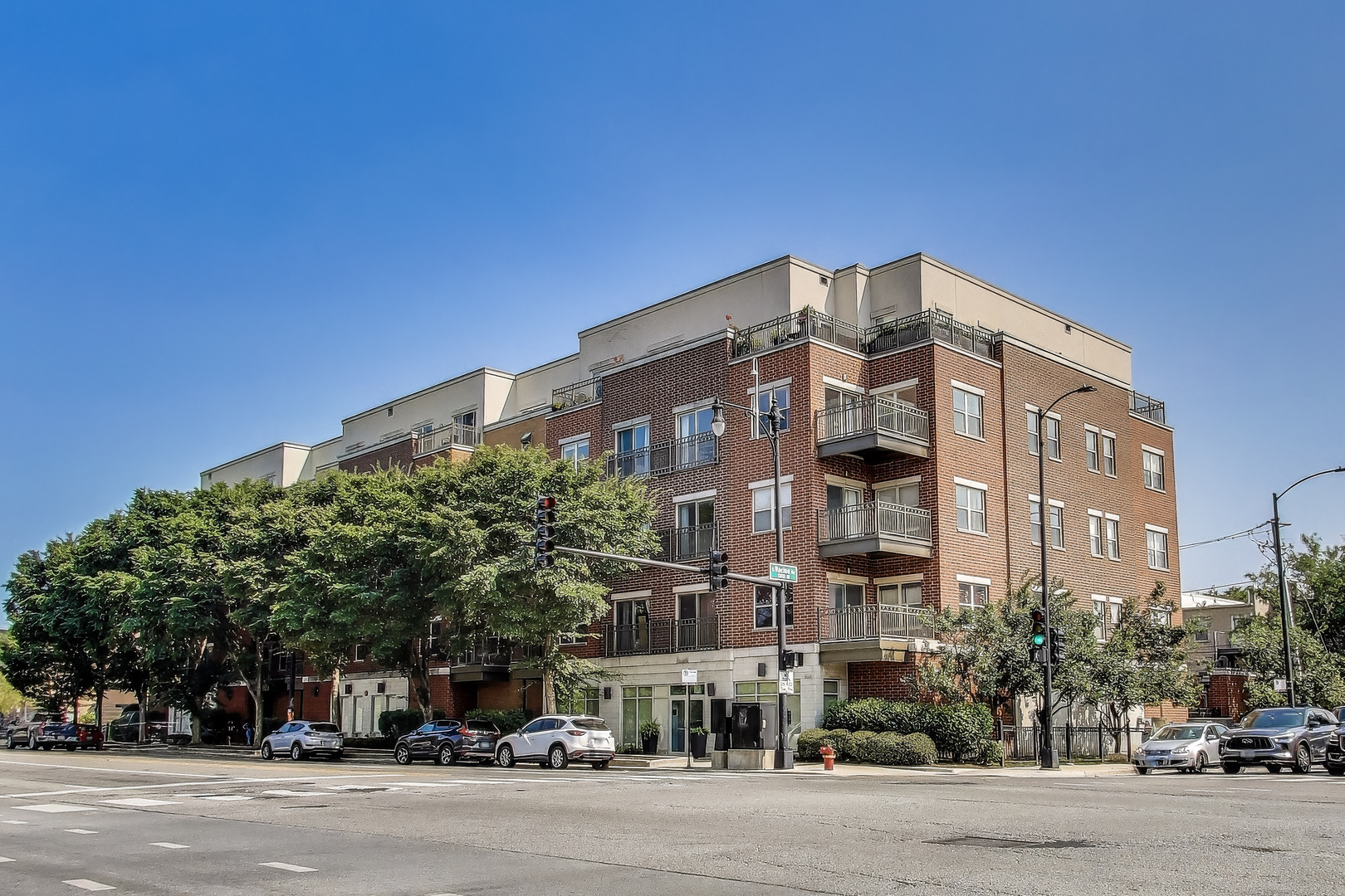 Bright and sunny three-bedroom, two-bath northeast corner unit with stunning views of Chicago. Beautiful kitchen features stainless steel appliances, quartz countertops, cherry cabinets, and a breakfast bar. Enjoy a separate dining area and a spacious private balcony off the living room -perfect for entertaining. Large split floorplan with primary suite including a walk-in closet and a dual vanity. In-unit laundry, heated garage parking and additional storage are included. Building amenities include a fitness center. Ideally situated in Roosevelt Square near UIC, Tri-Taylor, the Illinois Medical District, and Little Italy, with easy access to Taylor Street dining, public transportation, and major expressways. Pet friendly and investor friendly elevator building.