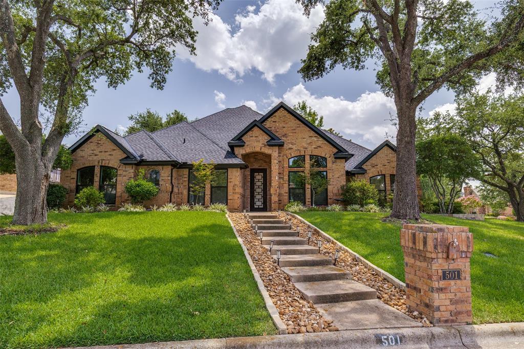 Nestled in the desirable Saddlebrook community, this beautifully updated residence seamlessly blends timeless elegance with modern comfort, offering an exceptional living experience in the heart of Colleyville. Thoughtfully renovated from top to bottom, this exceptional 5-bedroom, 4-bath residence, 1.5 story home offers designer-inspired living space. From the moment you step inside, you'll be captivated by the custom white oak flooring, designer lighting, curated finishes, and open-concept layout designed for both everyday living and effortless entertaining. The chef's kitchen is truly the heart of the home, featuring premium Gaggenau appliances, custom cabinetry, stunning quartzite countertops, a built-in seamless refrigerator, wine chiller, steam oven, overhead commercial vent hood, induction cooktop, oversized island, and abundant storage. The spacious primary suite serves as a private retreat with a luxurious spa-inspired bath showcasing a spectacular dual steam shower, vanity with Illuminated mirrors, free-standing modern soaking tub and elegant finishes. Multiple living and dining areas while the upstairs game room and additional bedroom create the perfect space for guests. Situated on a beautifully landscaped corner lot shaded by mature trees, the backyard offers privacy and room to relax, entertain, or create your dream outdoor oasis. Beyond the stunning interior renovations, buyers will appreciate the extensive upgrades, including the roof, windows, and HVAC units, making this home as functional and dependable as it is beautiful. Meticulous attention to detail throughout completes this remarkable property. This one-of-a-kind Colleyville gem combines luxury, convenience, and top-rated schools in one exceptional package.