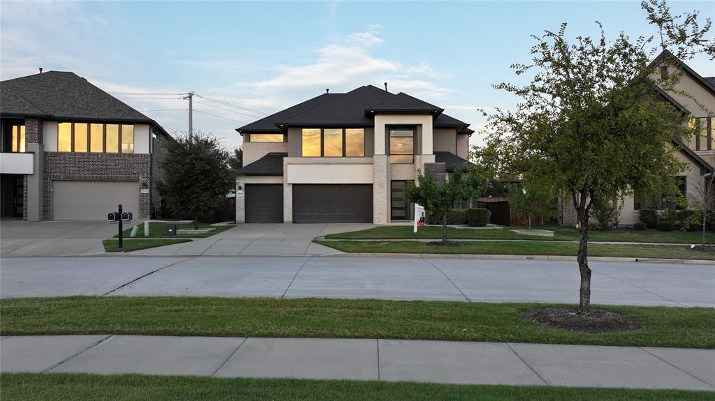 A bold contemporary architectural masterpiece in Frisco’s highly sought-after Philips Creek Ranch. This home is stunning, with clean lines, oversized modern windows, and striking architectural design. Every detail reflects elevated style and cutting-edge sophistication.

Inside, it’s a true showstopper—bright, open, and soaring with 20-foot ceilings. With 5 spacious bedrooms, 5 full baths, and a sleek half bath, there’s room for everyone and then some. A separate dining room adds a touch of elegance, while natural light pours in through the expansive windows.

Smart living is built in: voice-activated blinds, Hunter Douglas shades with remotes, smart lighting, and upgraded daylight energy-efficient bulbs throughout. It’s a high-tech haven wrapped in stunning design.

Residents enjoy complimentary access to two resort-style pools and a fully equipped gym, all maintained by the HOA—making it smart and cost-efficient to maximize your backyard for entertaining and outdoor living.

And speaking of the backyard—ditch the lawn mower! It’s finished with sleek turf and porcelain tile, while the HOA handles the front and side lawns. All the beauty, none of the hassle.

Bonus: this home comes equipped with a Tesla charger.

Schedule an appointment Today!