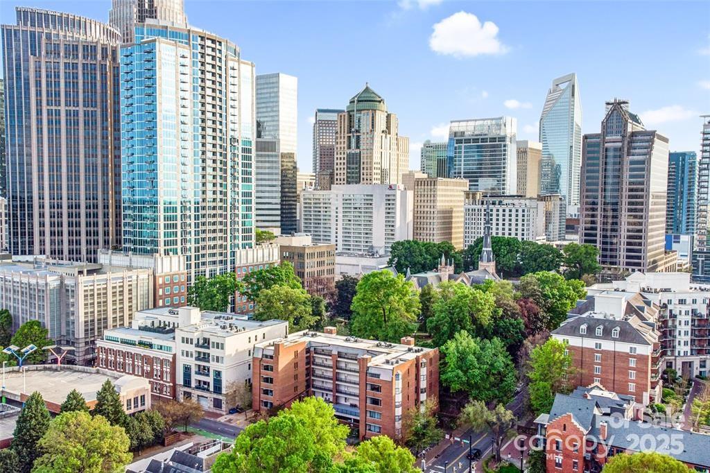Nestled in the vibrant heart of Charlotte's historic Fourth Ward, this charming one-bedroom, one-bathroom condominium at 224 N Poplar Street, offers a fantastic urban living experience. Step inside to discover a thoughtfully renovated space featuring sleek stainless steel appliances, including a convenient wine rack and built-in wine cooler, complemented by elegant granite countertops. The bathroom has also been tastefully updated. Residents of this secure building benefit from peace of mind and the convenience of an included parking space. For added flexibility, an additional parking space is available with a guest parking pass. Beyond the walls of this comfortable condo lies an unparalleled location, placing you within easy walking distance of daily necessities as well as the exciting entertainment options that define this dynamic neighborhood. This property offers a wonderful opportunity to embrace the coveted Fourth Ward lifestyle, surrounded by the energy of Charlotte.Use preferred lender to buy this home and receive an incentive towards your closing costs!