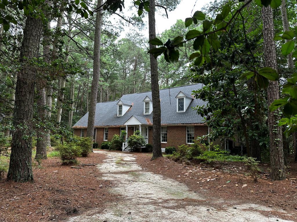 Experience complete privacy and tranquility in this captivating custom-built waterfront home nestled on 8.5 acres of land, lovingly named "Holly Bank". Enjoy the luxury of three bedrooms, each with its own private bathroom. An additional detached garage with a spacious room above, offering ample storage and endless possibilities. Take in the breathtaking views of the creek and explore the shore from your own private dock. Recent upgrades to heating/cooling, water softener, new roof (2023), central Vacuum system and so much more! Downstairs has an open flow with loads of windows and bonus spaces throughout! Added charm with the fireplace mantels and wood paneling made from the trees on the property :) Make this oasis your home today!