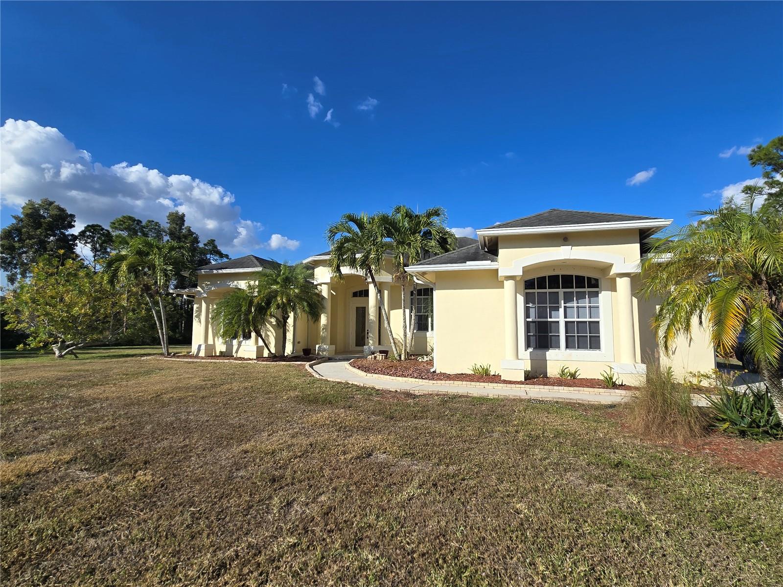 THIS IS A MUST SEE! Rare opportunity to own a substantially upgraded home on 1.15 acres in Loxahatchee with no HOA. Located in the desirable Acreage, this property offers the ideal blend of small town living, wide-open space, privacy, and access to modern conveniences. Zoned for versatility and well-suited for equestrian use, outdoor recreation, and those seeking a tranquil acreage lifestyle without sacrificing proximity to shopping, dining, and major roadways.Offering nearly 2,500 sq ft of living space, this move-in ready home features a refreshed interior with new carpet throughout, new interior doors and windows, updated lighting, ceiling fans, blinds, and fresh interior paint. The functional layout is ideal for both daily living and entertaining. The guest bathroom has been fully renovated, as well as the kitchen, which has upgraded cabinets, all new appliances and flooded with natural light. Shutters included.Recent system upgrades include a new A/C system, new hot water heater, new water softener & water filtration system, and new garage door opener, providing added peace of mind for the next owner.The expansive lot is beautifully landscaped with mature fruit trees and open space offering endless possibilities, including room for a workshop, RV or boat parking, future pool, or simply enjoying the privacy and freedom that define acreage living. Perfect for those seeking a warmer climate, less congestion, more land, laid back, and more affordable living.Seller incentives available, including Acrisure Net Payment Advantage, allowing eligible seller contributions to be applied toward reducing the buyer’s monthly payment, subject to loan guidelines and buyer qualification.Schedule your private tour today before others realize this incredible value and the bidding wars begin. Call me today for your private....there is so much more to see....