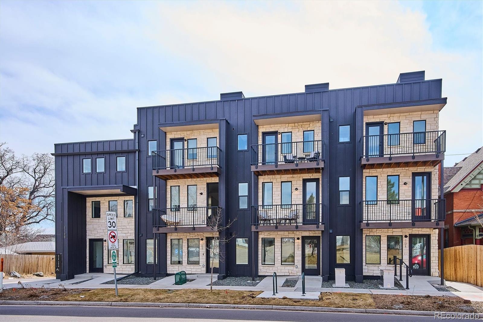 Price reduced $60,000 on this brand new Sloan's Lake townhome.  This is one of the best values in the Sloan's Lake area.  Contemporary design meets comfort in these stylish townhomes that feature open concept 2 bedroom plus den/office floor plans, high-end finishes, and thoughtful details designed for modern living.  Large windows bathe each room in natural light and spacious kitchens with quartz counters, ceramic/mosaic back splashes, soft close cabinetry and premium Samsung appliances make entertaining a joy.  Whether you're hosting friends on your roof top deck (per plan) or on your balcony (per plan) or enjoying a quiet evening at home, you'll love the comfortable and functional layouts.  Nestled just steps from the picturesque Sloan's Lake and it's expansive park, this is the perfect place to embrace outdoor adventures, from jogging, tennis and paddle boarding to picnicking and birdwatching. Enjoy easy access to a variety of local restaurants, trendy cafes, and boutique shopping - all within walking distance.  Plus, downtown Denver is just a short drive away, with seamless access to I-25 and I-70, making commuting and access to Colorado's mountains a breeze.   Live where you play, work and thrive.  Experience the perfect balance of city and lake side living in one of Denver's most coveted neighborhoods.  Photos shown are from model residence and may not exactly represent this specific residence.