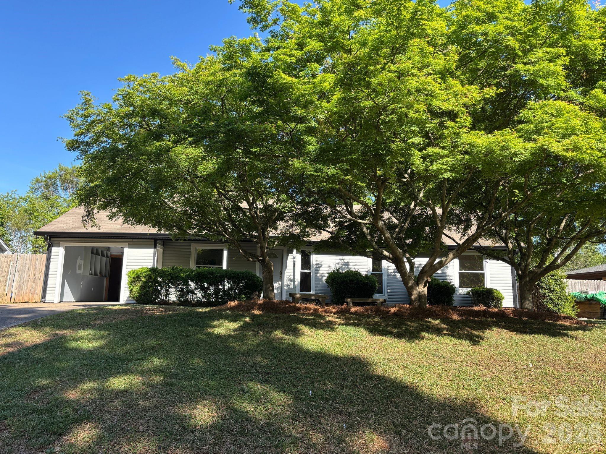 Step into this adorable, move-in-ready 3-bedroom, 2-bath ranch in the sought-after Windmere community. No HOA! Boasting a functional split floor plan across 1,410 sq. ft., the interior has been beautifully updated to offer a cozy, quaint atmosphere. Major big-ticket items are already handled: HVAC (2023) and Roof (2017).  Property was taken off the market to install new siding, new gutters, and new back porch steps. Outside, you’ll find a massive .34-acre lot with four storage sheds—perfect for hobbies or gear.The location is unbeatable with easy access to I-485 and all the charm of Mint Hill.