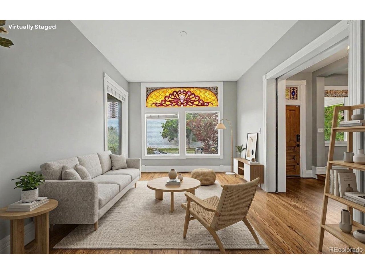 A rare opportunity to own a fully reimagined Victorian in Denver's historic San Rafael neighborhood, where timeless architecture meets modern luxury across more than 3,200 finished square feet. Originally built in 1884, this four-bedroom, four-bath residence blends preserved character with thoughtful updates.The main level welcomes with rich hardwood floors, soaring ceilings, and beautifully restored details. A spacious living room centers around a gas fireplace, while the formal dining room is ideal for entertaining. Exposed brick walls, stained-glass windows, and custom millwork add warmth and character throughout. The chef's kitchen features custom cabinetry, granite countertops, a statement island, stainless steel appliances, and an original brick hearth repurposed as a striking focal point.Upstairs, the primary suite offers a fireplace, walk-in closet, and spa-inspired five-piece bath. Two additional bedrooms and a full bath complete the second level. The third floor provides exceptional flexibility with a large bonus room, office, bedroom, and full bath, ideal for guests, creative space, or remote work.The finished basement expands the home's versatility with a spacious recreation room, additional bedroom, bath, laundry area, and storage. Outside, the private backyard creates an inviting urban retreat with a hot tub, fire pit, mature landscaping and multiple entertaining areas. A detached three-car garage, a rarity in the neighborhood, adds exceptional convenience.Located minutes from downtown Denver, RiNo, City Park, restaurants, coffee shops, and cultural attractions, this home offers an exceptional combination of historic charm, modern comfort, and walkable city living.  If rented, this home estimates a 6-7% cap rate. Bring All Offers.
