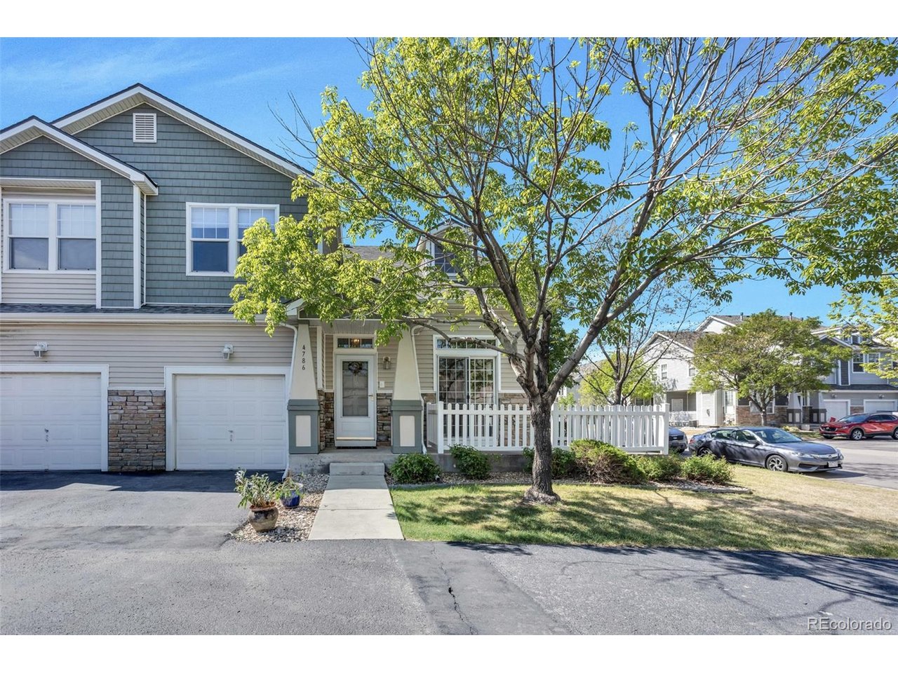 Welcome to 4786 Flower Street - where comfort, convenience, and Colorado living come together beautifully in one of Wheat Ridge's most desirable locations.From the moment you arrive, you'll feel the peaceful charm of this inviting corner-unit home surrounded by mature trees, quiet streets, and welcoming curb appeal. Inside, soaring ceilings and sun-filled living spaces create an open, airy atmosphere that instantly feels like home. The thoughtful layout offers the perfect balance of comfort and functionality, whether you're entertaining guests, enjoying a quiet evening, or simply relaxing after a long day.The spacious kitchen flows seamlessly into the dining and living areas, creating an effortless connection perfect for everyday living and entertaining. Large windows fill the home with natural light, while the upstairs bedrooms and flexible loft space offer room to work from home, unwind, or create your own personal retreat.What truly makes this home special is the lifestyle that surrounds it. Imagine starting your mornings with a peaceful 10-minute walk to Anderson Park or a bike ride along the scenic Clear Creek Trail. Enjoy the convenience of being just 15 minutes from Downtown Denver, museums, and entertainment while also being only minutes from Colorado Mills shopping, dining, and everyday essentials including Costco and Wheat Ridge Marketplace.Commuting and travel are simple with quick access to I-70, offering a straight shot to DIA in approximately 25 minutes and easy mountain getaways whenever adventure calls. The new Intermountain Health Lutheran Hospital is only 5 minutes away, adding another layer of convenience and peace of mind.Beyond the location, sellers love the quiet, friendly neighborhood atmosphere along with the responsive HOA and management company that help maintain the community beautifully. Major exterior updates including newer windows, roofs, and siding completed since 2020 provide added value and confidence for future homeowners.