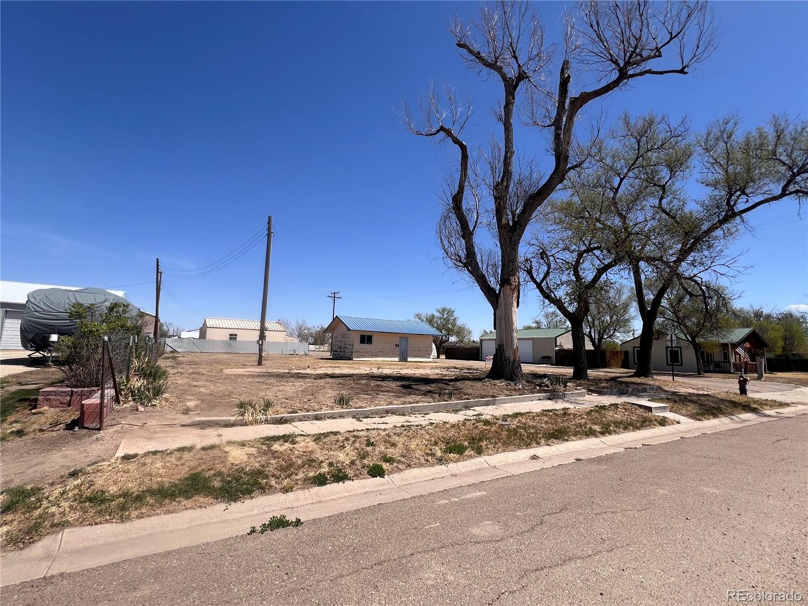 Build Your Vision in Hugo, Colorado Opportunity is calling with two residential lots in the welcoming community of Hugo, Colorado. Whether you’re dreaming of building a single-family home, or multi-family housing, this property offers flexibility to match your goals.Enjoy the charm of small-town living with wide open skies, peaceful surroundings, and room to grow. These lots provide a great setting for those looking to invest, build, or create a place to call home at a comfortable pace.With residential zoning you have options—whether you’re planning for personal use, multi-generational living, or income potential. Infrastructure is in place including streets, water, sewer, gas and electric. A small garage is currently located on the property but could be removed to begin with an open slate.If you’ve been looking for a spot where you can take your time and build something meaningful, this could be just the right fit.Zoning uses include single or multi-family homes, manufactured and modular homes are allowed with some restrictions.Neighborhood uses: Salons and barbershops, Bakeries, Small-scale offices, Small-scale restaurants, Bed and Breakfasts, Child Day Care Centers.Have an idea, schedule a showing, let's talk.