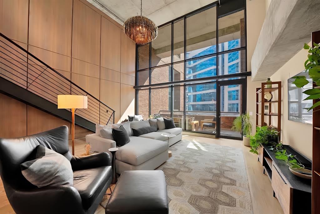 Experience exceptional Uptown living in this beautifully updated loft-style condo in an exclusive building just steps from Klyde Warren Park, American Airlines Center, Victory Park, and the renowned restaurants and entertainment along McKinney Avenue and the Crescent.This spacious 2-bedroom, 2-bath residence features a versatile study and dramatic city views through two stories of glass. The open-concept interior showcases beautifully stained wood floors, a striking walnut wood feature wall, and a stylish blend of contemporary finishes and urban loft character.The kitchen has been thoughtfully updated with all-new cabinetry, countertops, hardware, and stainless-steel appliances. Both bathrooms have been transformed with new cabinetry and countertops, new faucets, toilets, shower and bathtub surrounds, and beautiful new tile. New cabinetry has also been added to all closets, providing exceptional storage and organization.The extensive updates continue throughout the home with new door hardware, light fixtures, ceiling fans, blinds in the primary bedroom, and an elegant iron door upstairs. Fresh paint throughout—including walls, cabinetry, and ductwork—creates a crisp, cohesive look, while designer wallpaper adds distinctive character.Enjoy the spacious balcony, fabulous community pool, cookout areas, two reserved garage parking spaces, a gym, and controlled building access. With its extensive updates, sophisticated design, and unbeatable Uptown location, this exceptional residence offers stylish in-town Dallas living at its finest.