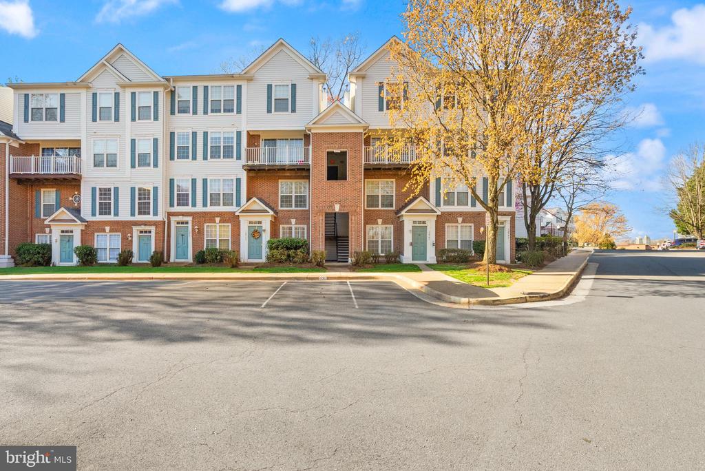 Ideally situated just off I-66 in the sought-after Fair Lakes area, this well-appointed third-floor corner residence offers both comfort and convenience in a vibrant Northern Virginia setting. The location places you moments from a wide variety of shopping, dining, and everyday essentials, while still providing a peaceful residential atmosphere. Inside, the home features an open and inviting layout designed for both daily living and entertaining. The kitchen flows seamlessly into the main living area, where a striking three-sided fireplace creates a warm focal point and enhances the sense of space. Large windows invite natural light throughout, while the corner position offers added privacy and pleasant views. Step outside to a spacious private balcony, complete with additional storage, providing a great place to relax or enjoy fresh air. The upper level offers two generously sized primary suites, each with its own private bath, creating flexible living arrangements. A conveniently located upper-level laundry area adds to the home’s thoughtful design. Fair Lakes is known for its dynamic blend of residential living and nearby amenities, offering access to scenic walking trails, recreational courts, and community spaces. With easy access to major commuter routes including I-66, Route 50, and Fairfax County Parkway, this location supports both everyday convenience and regional connectivity. Combining a functional layout, comfortable living spaces, and an ideal location, this home presents an excellent opportunity to enjoy all that the Fair Lakes area has to offer.