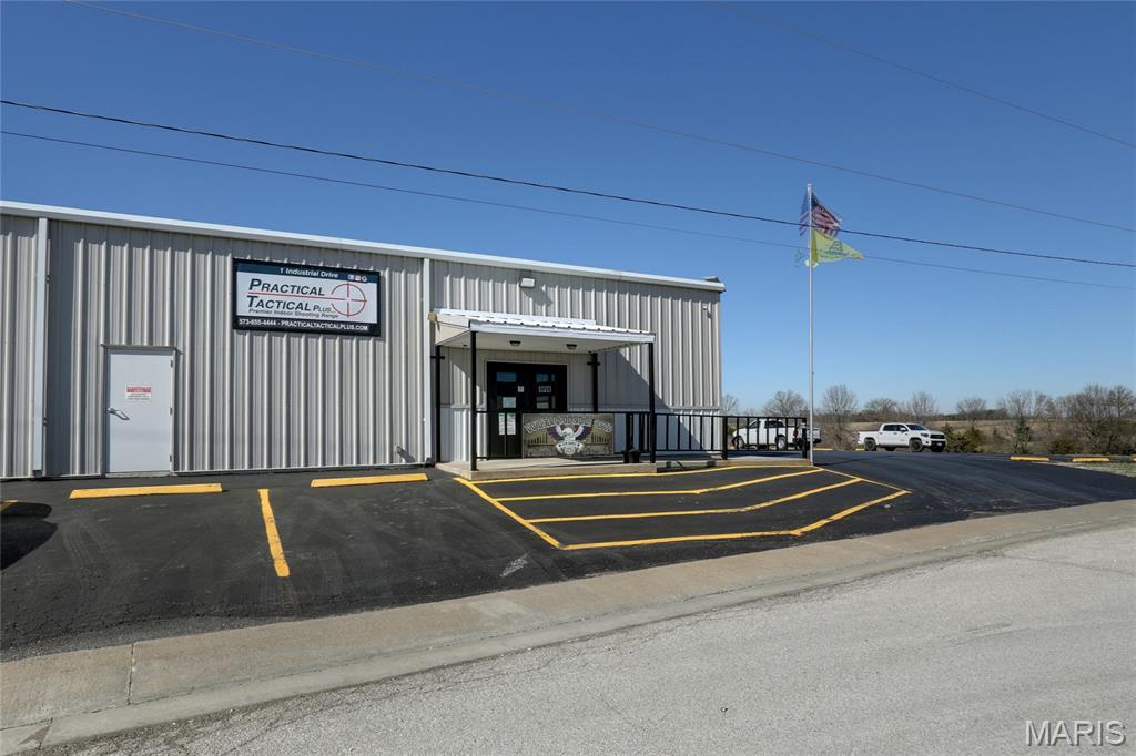 Exceptional opportunity to acquire a purpose built indoor shooting range facility offering immediate income potential in the established LaGrange, MO Industrial Park. This ±9,000 square foot building sits on 1.4 acres of frontage with ample on-site parking (25 spaces) and is designed for both performance and durability.This state-of-the-art indoor range facility with advanced tactical targeting systems features five 50-yard rifle lanes and eight 30-yard pistol lanes, all equipped with programmable shooting capabilities for dynamic training and customizable user experiences. Constructed with 9-inch concrete walls, the range is fully outfitted with ballistic rubber lining and a rubber bullet trap system, and is rated up to .338 Lapua, accommodating a wide range of firearms use. Approximately 1,000 square feet is dedicated to retail, classroom, and office space, creating additional revenue opportunities through training, merchandise, and memberships.Additional highlights include: • Metal exterior construction for long term durability • Three-phase, 800-amp electrical service • City water and sewer • High end professional grade ventilation system designed for indoor range use • Tactical programmable Range Systems™ targeting throughoutThis property is ideally suited for investors or owner-operators seeking a high-demand recreational and training facility with immediate income potential.