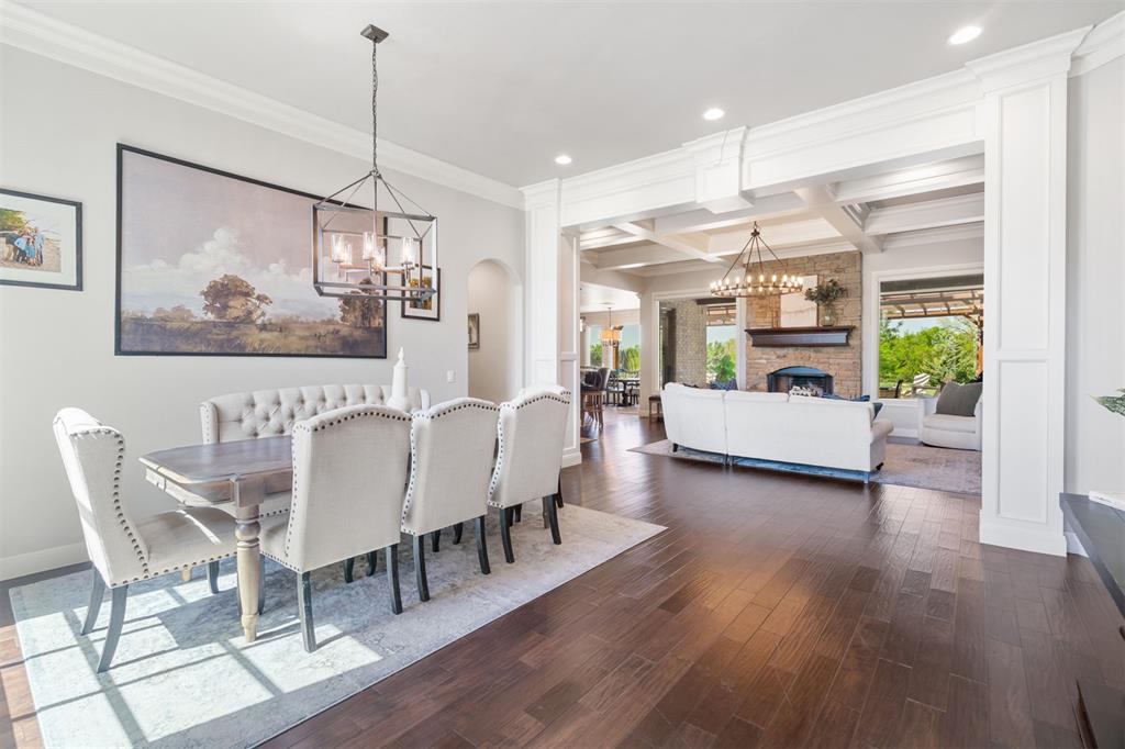 Welcome to a place where elegance meets serenity. Nestled on a beautifully landscaped .95-acre lot with a private treed greenbelt backdrop, this timeless home in the prestigious gated community of Villagio offers the perfect balance of peaceful living and refined luxury.
From the moment you enter, the light-filled foyer sets a calming tone, flowing seamlessly into the formal dining room and a spacious living area anchored by a stunning masonry fireplace. Expansive picture windows bring the beauty of nature indoors, framing lush backyard views and creating an effortlessly tranquil atmosphere.
Thoughtfully designed with a rare single-level bedroom layout, this home features 4 spacious bedrooms, 3.1 baths, a charming bay-window office, and a generous upstairs bonus room—perfect as a game room, media space, or second living area.
The kitchen is the true heart of the home, offering abundant counter space, warm cabinetry, and an extended breakfast nook overlooking the peaceful backyard. Step outside to your private retreat, complete with a built-in pergola and fire pit, designed for effortless entertaining or quiet evenings under the stars.
The primary suite is a calming sanctuary, with direct patio access and a spa-inspired ensuite featuring dual vanities, a soaking tub, walk-in shower, and makeup station. Three additional guest bedrooms are generously sized, including an extended guest suite ideal for flexible living arrangements.
Additional highlights include:
A large laundry room with mud bench off the garage entry
Porte-cochere driveway with gated closure for enhanced privacy
Four-car garage with ample storage and storm shelter
Move-in ready and thoughtfully maintained, this residence offers a rare opportunity to experience luxury living in a peaceful, park-like setting—just moments from city conveniences, yet worlds away in feeling.