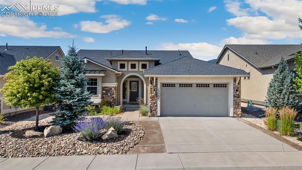 Come glimpse Waterfront Paradise with Spectacular Views of the majestic Mountain Range and the Tranquil Blue Lake from this stunning Forest Lakes Home, located on a Premier Lot backing to Pinon Lake, evoking a sense of tranquility and escape in a place where one can unwind and enjoy the Natural Beauty and year-round Resort-like Living. All the West-facing Rooms in the house, including the deck and the covered flagstone patio, Offer Sweeping, Picturesque Views. This tastefully designed, Open-Concept, elegant Ranch Home is enriched with Classy Upgrades, and looks like a Model Home. It features a Bright and Spacious Layout with 4 Bedrooms, 3 Bathrooms, and a Main-Level Office with French Doors. The Main Floor Exquisite Great Room features a Stone Fireplace, Luxury Vinyl Flooring, a Wall of Windows, and a Walkout to an incredible Deck for relaxing or entertaining. Gourmet Kitchen features Granite Countertops, a Tile Backsplash, a Center Island with a Breakfast Bar, a Gas Range, and a Pantry. The magnificent Primary Suite features Sweeping Views from the Bed, a door to the Deck, an Adjoining Bathroom with Walk-in Spa Shower, a Double Vanity, a Walk-in Closet, and an adjoining Laundry Room. The wonderful Walk-out Basement is perfect for Family Fun & Entertaining, featuring a generous 28’x17’ Family Room complete with a Stone Fireplace and a Wet Bar. Additionally, there are Two Bedrooms, a spacious Flex room, and a Full Bath. Step outside on the large Flagstone Patio, where you can stargaze & enjoy the Peaceful Ambiance created by the Water Feature and the Lake. The oversized 2-Car Garage has a 4-foot extension for a workbench area. The Xeriscape Yard is gorgeous. There are two 50-gallon Water Heaters & a New Roof in 2023. Forest Lakes has an extensive Trail System & Community Lakes where residents can Fish, Kayak, and Paddleboard. This home offers the best of both worlds – a Private Oasis with easy access to the essentials of everyday life & I-25, at an Incredible Price.
