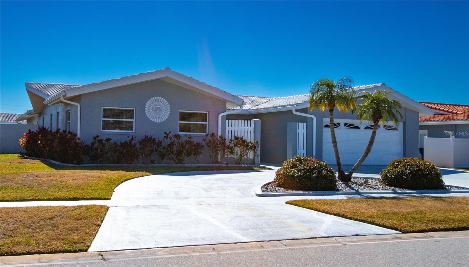 Welcome to Imperial Point! This three bedroom 3 bath home offers abundant light and plenty of room to make it your forever home. With over 2650 square feet of bright and airy living space, this split floor plan is bathed in sunlight throughout the house and is one of the largest homes in Imperial Point. A large great room is located just off of the front foyer. Currently it is set up as a combined living dining area. The house has undergone a significant expansion which added the third bedroom and and office or den, depending on your needs. Professionally painted in neutral tones, its ready for your colorful additions. The kitchen has stainless appliances and Corian countertops to make cleaning easy. There's a mix of hardwood floors for elegance and tile for whatever life throws your way. The current owner took great pride in this home, maintained and set the house up for family living. In addition to a fenced private back yard, the lanai is deep and offers a great resting place to garden or read a book. Leafguard gutters were added in 2025. Imperial Point offers exceptional amenities, community heated salt water pool, clubhouse including a fitness center, tennis or pickle ball courts and a boat ramp that sits on the Intracoastal Waterway, minutes from St Pete, thirty minutes to Tampa International Airport and world class healthcare.