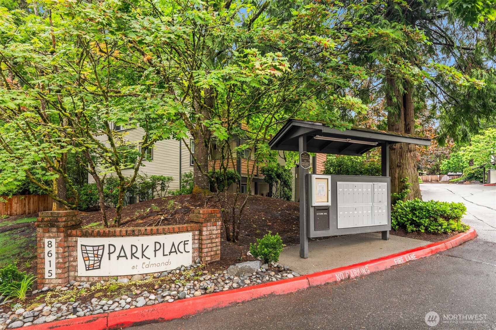 Beautifully updated and move-in ready Edmonds condo offers privacy, comfort, and exceptional convenience. Bright, open living spaces feature luxury vinyl plank flooring, a welcoming brick fireplace, and seamless access to a secluded, covered patio overlooked by mature trees. Expansive windows enhance dedicated dining area. The kitchen blends style and function with granite counters, stainless appliances, light-toned cabinetry, and a breakfast bar with room for seating. Spacious bedrooms provide abundant storage, including a primary suite with ensuite bath. Recent updates add peace of mind, while in-unit laundry, exterior storage, covered parking, and ample guest parking enhance everyday living. Enjoy a well-managed community just minutes from downtown Edmonds, waterfront parks, dining, shopping, I-5, and Highway 99.