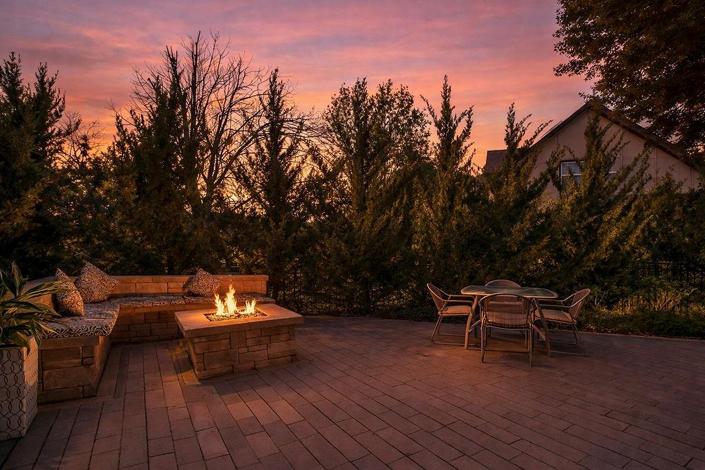 Welcome to this stunning and spacious 1.5-story home designed for both comfort and entertaining! The custom gourmet kitchen is a chef’s delight, boasting top-of-the-line Viking appliances, a gas range, and a generous island perfect for meal prep and casual gatherings.Step outside to your private retreat featuring an outdoor kitchen and a cozy fire pit—ideal for relaxing or entertaining year-round. Inside, the main level impresses with a formal dining room, a bright great room with expansive windows and a see-through fireplace, a private office, and a luxurious primary suite.Upstairs, you’ll find three spacious bedrooms and a versatile loft area—perfect for a playroom, reading nook, or extra workspace. The finished walkout lower level offers even more room to enjoy, including a family room, wet bar, rec area, and an exercise room.Nestled on a quiet cul-de-sac with a fenced yard and easy lake access, this home combines privacy, elegance, and convenience. A backyard gate leads directly to the sidewalk and dock, just steps away.This home truly has it all—style, space, and a perfect setting for everyday living or entertaining!