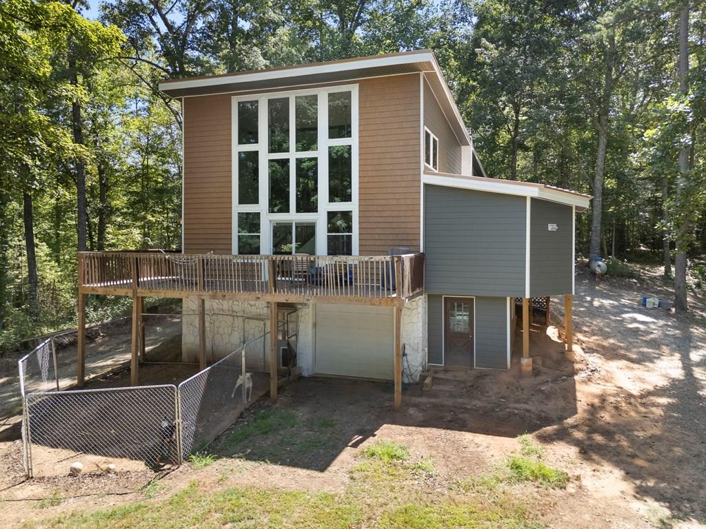 RARE FIND — Surrounded by Nature & Privacy! Tucked away on over 5 private acres and bordered on three sides by US Forest Service land, this one-of-a-kind property offers unmatched seclusion, serenity, and space to roam. The 3 bedroom, 3 bathroom home has been recently updated with new windows, new siding, new flooring, and beautifully updated bathrooms—giving you peace of mind and modern comfort in a private mountain setting. A full basement and 1-car garage offer ample storage and flexibility for your lifestyle.  Step outside and immerse yourself in nature, with wildlife, wooded trails, and endless quiet right out your back door.  Offered at just $319,800, this hidden gem is unlike anything else on the market. If you've been waiting for something truly special, don't let this one pass you by.