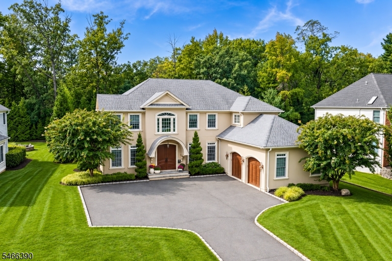 Welcome to this extraordinary custom-built residence by renowned Ferro Builders, ideally situated on a beautifully landscaped, private half-acre property in the coveted Brightwood Park section of Prospect perfect for the buyer looking for design, sophistication & effortless everyday living. The thoughtfully designed first level includes the chef's kitchen featuring high-end appliances, custom cabinetry w timeless double quarzite, seamlessly flowing into the family room, a luxurious first floor en suite bedroom, an additional bedroom/private office, an elegant powder room, & a convenient mudroom off the oversized 2 car garage plus a fully integrated indoor speaker system throughout. Additional highlights include a soaring 20' foyer, elegant formal dining & living rooms, complemented by a beautifully appointed butler's pantry featuring a sink, dishwasher & refrigerator for exceptional entertaining. Sliding doors lead to an expansive patio overlooking picturesque, wooded grounds surrounded by mature trees, creating a tranquil and exceptionally private outdoor retreat. Upstairs, the magnificent primary suite is a true sanctuary, complete with a private balcony, 2 generous walk-in closets, and a sumptuous marble bath, an additional en-suite bedroom plus two spacious bedrooms complete the second level. Expansive lower level, soaring ceilings, an additional bedroom/bath, fitness room provide exceptional versatility. Walk to schools, transportation to NYC & vibrant downtown Westfield