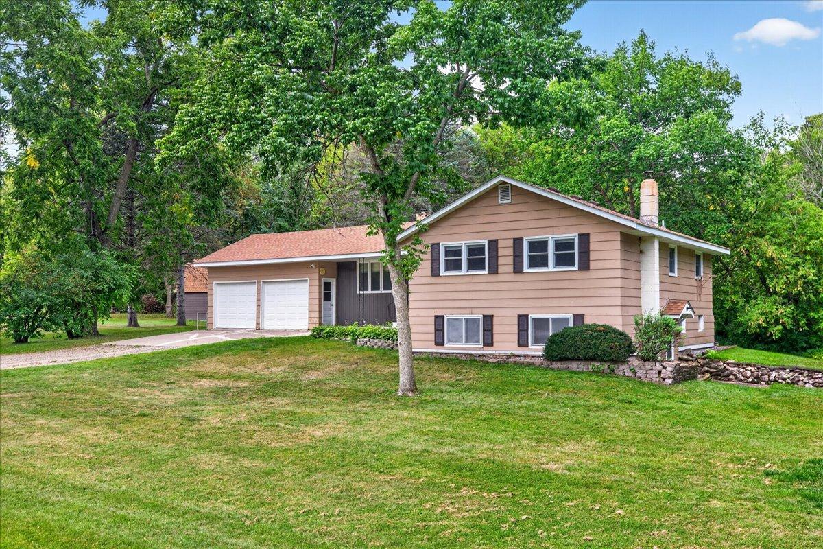 Great opportunity to build equity on this solid-built home on 5 acres. The seller has contracted for the installation of a new mounded septic system. It will be completed by the first week in November. The home needs updating. There are 3 bedrooms on the main level. Nicely wooded property with a good space to build an outbuilding just South of the house. There is a barn shaped shed, with storage loft, on the property. Large, private, screened porch overlooking the backyard. Lower level rooms are finished and there is an additional bathroom. The lower level is a walkout. The garage has 200 amp service for a welder, and a water faucet, and work bench.