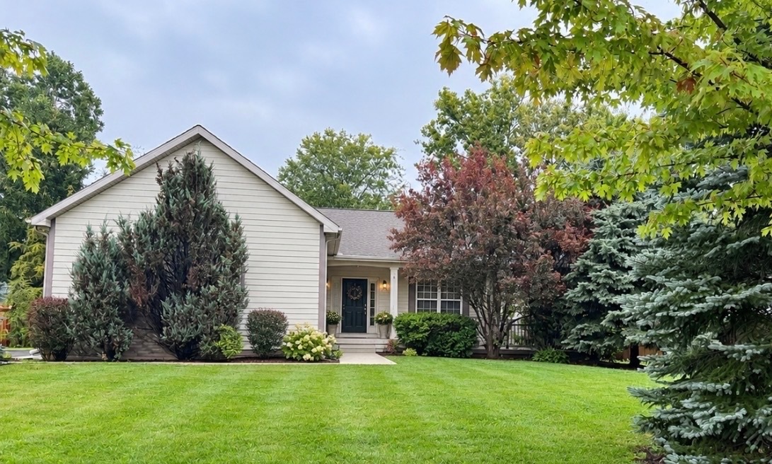 GORGEOUS CUSTOM HOME BUILT FOR ACCESSIBILITY!   Set in a serene Winthrop Harbor location offering complete privacy but with neighbors close by for peace of mind. Built with ADA compliance in mind, the home offers wide doorways, accessible light fixtures, a roll-in shower, and a walk-in tub in the primary ensuite. Plenty of living space in this home! Upon entering you are greeted on the right with a delightful sitting area/sunroom a bit removed from the hustle and bustle of the main living space. Right next to that is a den perfect for a home office! Soaring ceilings and an open-concept layout create an exceptional sense of space throughout the main living areas. The combined living, dining, and kitchen area is ideal for everyday living and entertaining, with abundant cabinetry and generous counter space. The impressive floor to ceiling wood-burning brick fireplace in the main living area provides a cozy ambiance and a natural sensory experience.  The thoughtfully designed split-bedroom floor plan features a spacious primary suite on one side of the home, with two additional bedrooms and a full bathroom on the other. Enjoy your morning coffee or unwind at the end of the day on your spacious, lighted patio in complete privacy and peace, surrounded by nature!  Additional highlights include main-floor laundry, a three-car garage, and a full unfinished basement offering plenty of potential for future living space, recreation, storage, or hobbies. You can have it all-privacy and neighbors, comfortable living for today and tomorrow, and extra space to grow as desired. Take the time to see this unique home! Schedule your private showing today! **Photo of front of home has been AI enhanced. Home is nestled behind mature trees for added privacy.