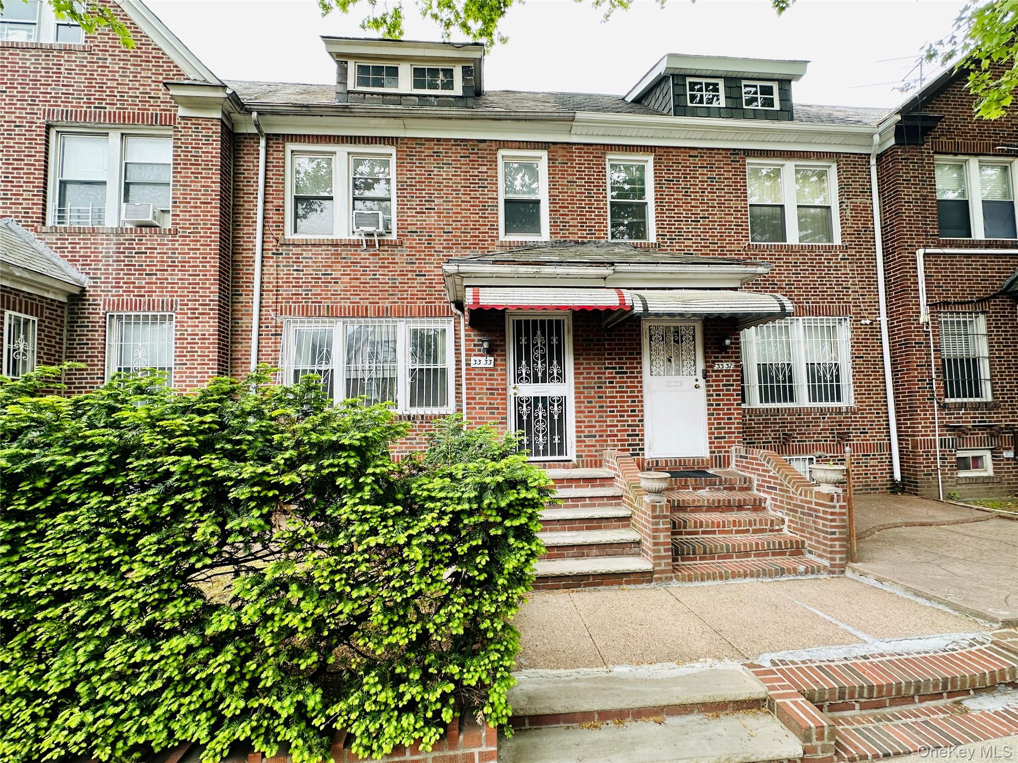 Welcome to this charming single-dwelling townhouse! This well-maintained residence is conveniently located in the heart of Jackson Heights and features a lovely front garden that adds warmth and curb appeal.The first floor boasts a spacious and sun-filled living room, a kitchen, and a formal dining room, perfect for everyday living and entertaining. As you go upstairs, natural sunlight pours in through the skylight above the hallway, creating a bright and inviting atmosphere. The second floor has three generously sized bedrooms, a full bathroom, and ample closet and storage space throughout.The fully finished basement provides versatile additional living space, including a utility room, laundry room, and an extra bathroom. The rear of the home features a three-level layout with a ground floor basement and direct access to the garage, allowing you to conveniently drive right in. In addition, the backyard includes extra outdoor space that can be used as a garden or converted into two private parking spaces.Surrounded by a beautiful neighborhood setting and conveniently located near public transportation, shopping, supermarkets, and everyday conveniences, this home truly has comfort and accessibility.