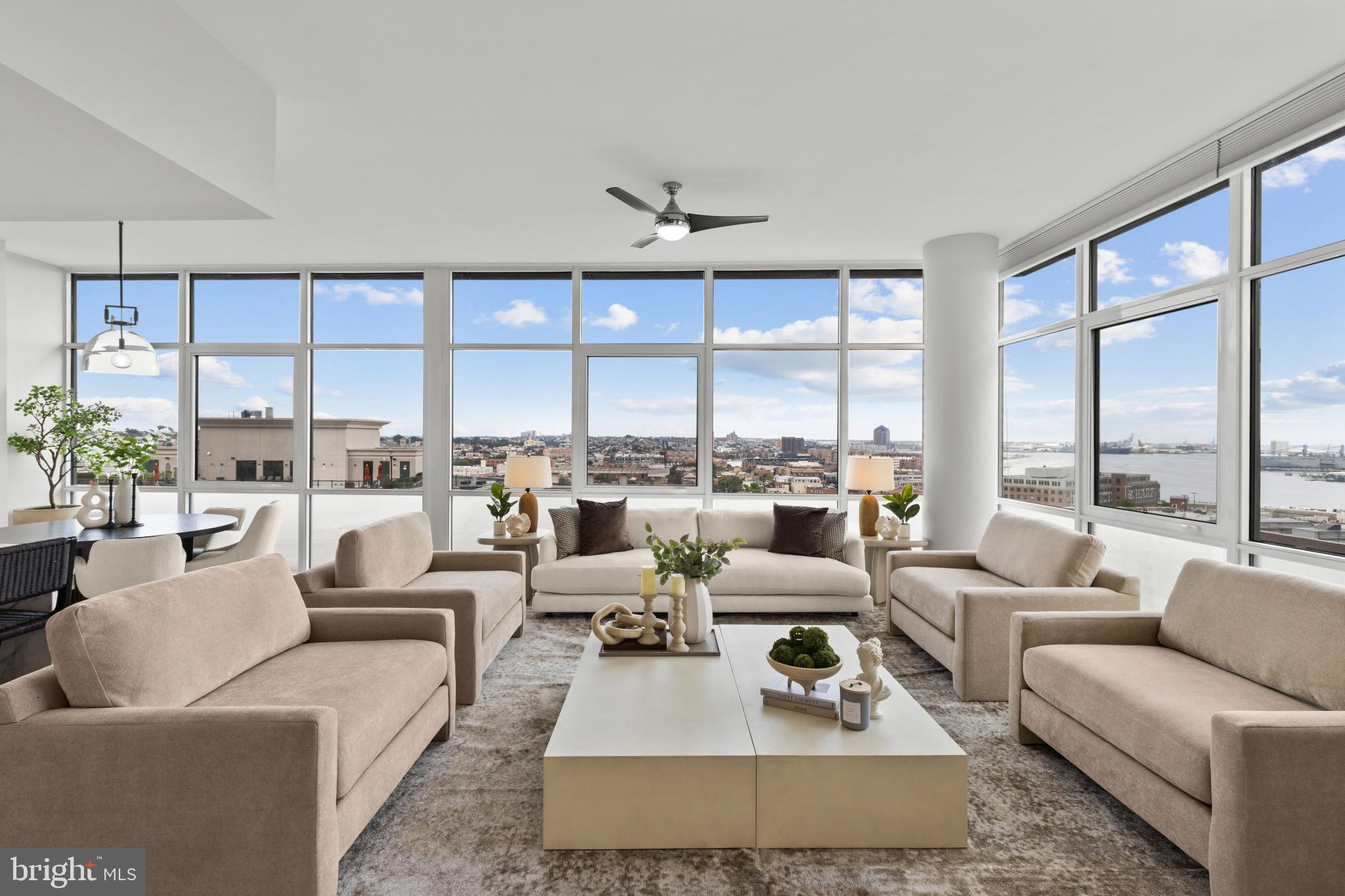This gorgeous 2-bedroom, 2-bathroom residence at Liberty East, in the heart of Baltimore’s Harbor East, has sweeping harbor and city views through floor-to-ceiling windows. Built in 2019, the open layout joins the luxurious kitchen, dining, and living spaces into one well-proportioned whole - ideal for entertaining or simply relaxing and enjoying the views. The gourmet kitchen features a suite of Thermador stainless steel appliances, a six-burner gas range, quartz countertops, and a generous island.  The natural light in the living room is incredible, and the fireplace adds warmth and character.  Throughout this property the ceilings are exceptionally high which adds to the feeling of spaciousness and light and creating a sense of comfort. The primary suite includes an adjoining den, an ideal space for a home office or study, with both spaces opening onto a private balcony with water and city views. The primary bath is a calm retreat with a large soaking tub, separate walk-in shower, and double vanities.  A large walk-in closet completes this comfortable and spacious owner’s suite.  A second bedroom, also with private balcony space, can be used any way a new owner may need – guest room,  family bedroom,  additional office, or yoga studio. A laundry room and great closet and storage space are added perks.  As a resident of Liberty East, you’ll enjoy the 9th floor amenities - fitness center,  outdoor infinity pool and large deck area,  very comfortable lounge area, conference table, and pool table.  A private dining room and small kitchen are all available for residents to reserve for special events with family and friends.   The Liberty East has a Whole Foods on site for extra convenience.   Harbor East is home to some of the city's best restaurants and cafes, along with shopping, a beautiful waterfront promenade, historic sites, and easy commuting access - all just steps from your door. Come visit this elegant move-in ready unit today to begin your new life of luxury.