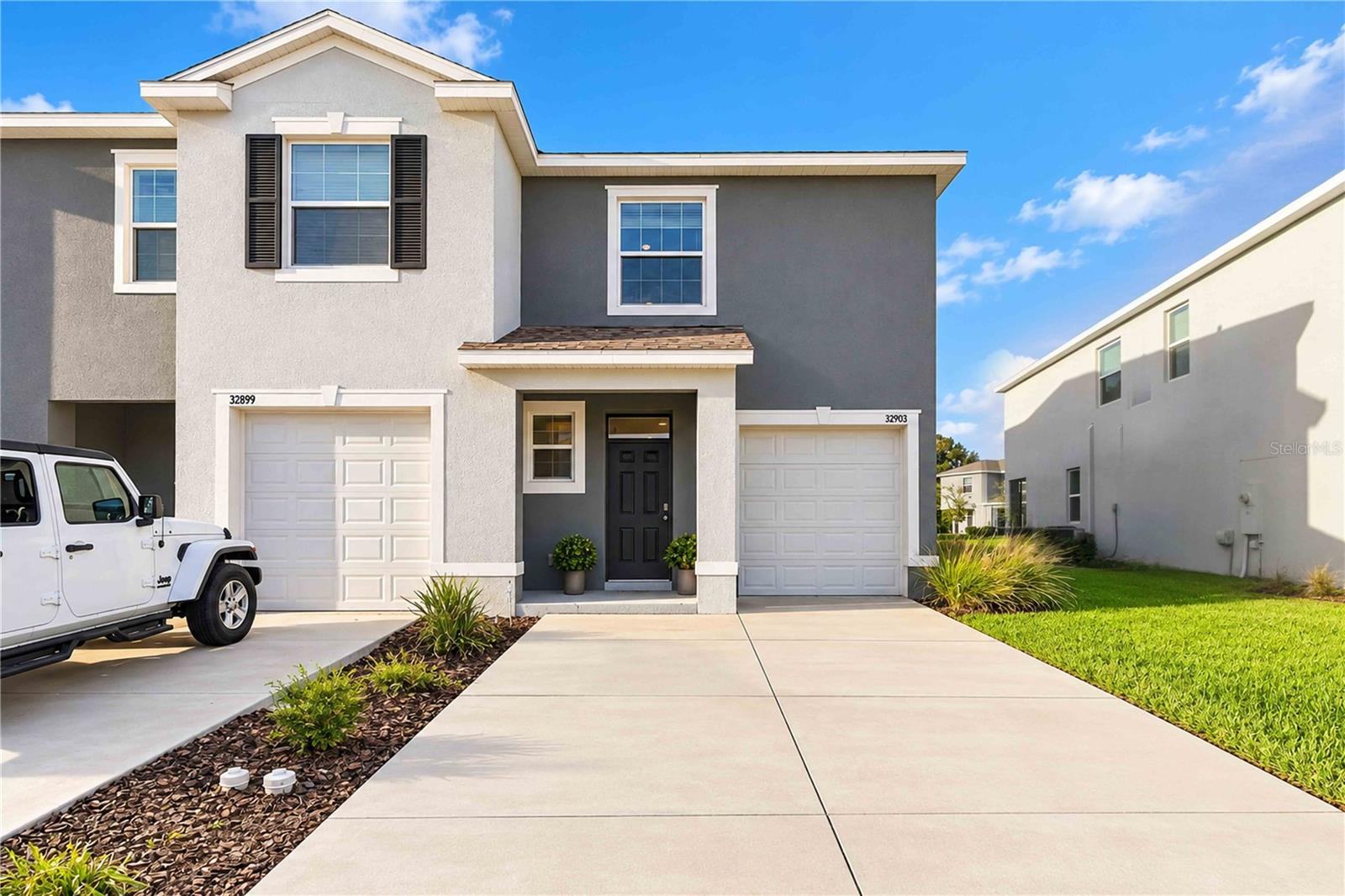 SPECIAL FINANCING OPPORTUNITIES AVAILABLE THROUGH OUR PREFERRED LENDER! Contact us for details. Financing subject to buyer qualification and lender approval.An incredible opportunity to own a nearly new, beautifully maintained END-UNIT townhome on a desirable corner lot in the sought-after Union Park master-planned community of Wesley Chapel! Built in 2022, this spacious 3-bedroom, 2.5-bathroom home offers 1,758 square feet of living space, abundant natural light, peaceful water views overlooking a scenic pond with no immediate rear neighbors, and low-maintenance living.Step inside to discover a bright, open floor plan designed for everyday living and entertaining. The spacious primary suite features TWO closets, while additional storage includes a convenient pantry and a unique "Harry Potter" under-stair storage closet just off the kitchen. This pet-free home features an ADT security system with sensors on all doors and windows, additional double locks on the sliding glass doors, a two-car driveway, and an upgraded garage with epoxy flooring.Enjoy peaceful water views from the upgraded screened-in lanai, a $1,600 addition perfect for morning coffee or relaxing evenings outdoors. The desirable end-unit location provides added privacy and natural light.Experience resort-style living in Union Park, where residents enjoy amenities including a resort-style swimming pool, lap pool, clubhouse, fitness center, splash pad, playgrounds, dog park, sports courts, outdoor fitness stations, scenic walking trails, a Zen garden, picnic areas, and more!Conveniently located near The Shops at Wiregrass, Tampa Premium Outlets, The Grove at Wesley Chapel, KRATE at the Grove, restaurants, grocery stores, and entertainment, with easy access to I-75 and I-275.Ideal for first-time homebuyers or anyone seeking a move-in-ready home, this property offers exceptional value in a growing Wesley Chapel location. Schedule your private showing today!