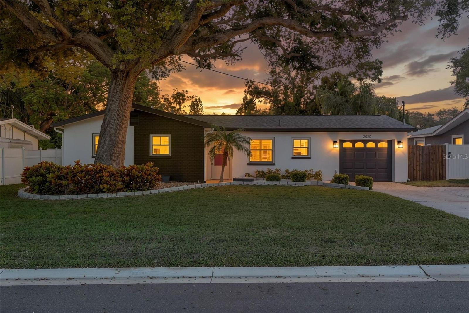 NEW TO MARKET!!! NEW TO MARKET!!! NEW TO MARKET!!!A PRIVATE RETREAT WITH THE BEST OF DUNEDIN CLOSE TO HOME! Situated on a picturesque wooded lot within walking distance of Hammock Park, this beautifully updated home blends timeless character, modern improvements, and the relaxed coastal lifestyle that makes Dunedin so special. With no HOA, a fully fenced backyard, and inviting indoor and outdoor gathering spaces, 2020 Valley Dr offers a peaceful place to unwind while staying connected to the places you love.Step inside to a bright, open floor plan where classic terrazzo flooring and abundant natural light create a warm, welcoming atmosphere. At the heart of the home, the beautifully updated kitchen features granite countertops, a stylish tile backsplash, updated cabinetry, a center island, upgraded stainless steel appliances, and generous lighting. An inviting eat-in dining area provides the perfect setting for morning coffee, while the seamless connection between the kitchen and living area keeps everyone together, whether you’re enjoying a quiet evening or hosting friends.Thoughtful updates continue throughout the bathrooms. The spacious main bathroom features dual sinks, a new bathtub, and extensive tilework, while the primary bathroom offers a beautifully tiled walk-in shower and updated vanity.Outside, mature landscaping and a fully fenced backyard create a sense of privacy that is a standout feature of this property. The patio’s impressive outdoor fireplace adds character and an inviting focal point for evenings under the stars. Picture dinner outdoors, conversation by the fire, and a peaceful place to enjoy Florida’s beautiful weather—right in your own backyard.Major improvements include a NEW ROOF AND NEW A/C IN 2024, along with hurricane-rated windows and sliding glass doors, adding meaningful value to this exceptionally well-maintained, move-in-ready home. The flood zone is "X".Beyond your front door, the Dunedin lifestyle awaits. Walk to Hammock Park, the Dunedin Community Center, the Dunedin Fine Art Center, and Highlander Park. Spend your mornings exploring nearby parks or cycling the Pinellas Trail, then head to vibrant Downtown Dunedin for locally owned restaurants, boutiques, craft breweries, and community events. Enjoy the marina and waterfront, catch a spectacular sunset, or make a beach day of it at the Dunedin Causeway and Honeymoon Island State Park—all within easy reach.From its oversized yard with no immediate neighbors to the back, it's distinctive outdoor fireplace to its updated kitchen and major improvements, this home brings together comfort, character, and a location that makes it easy to enjoy life in Dunedin. Come experience 2020 Valley Dr and discover your own piece of this Gulf Coast community.