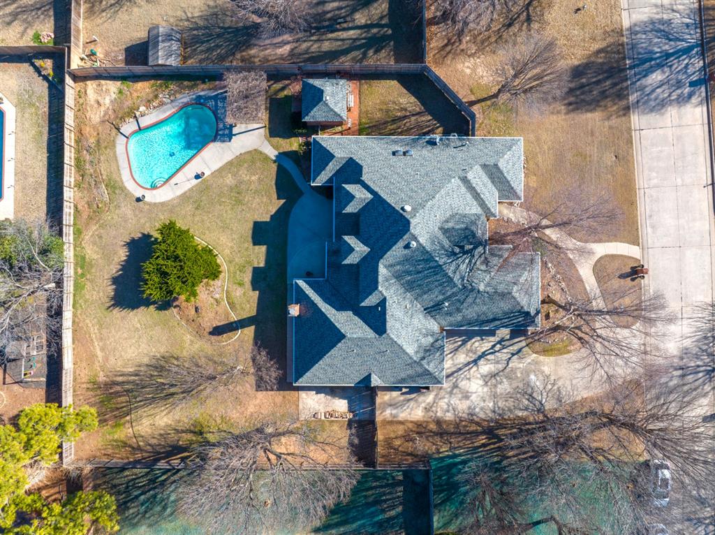 As you walk into this home the sightlines are unbelievable. This upscale home on half an acre with a 3 car garage, offers a commercial grade kitchen- with a new double door GE fridge, prep sink on a large island, built in ice maker, wine fridge, and a Thor stove & double oven, second peninsula with lower level pantry space & pull out shelving, two living spaces, fireplace, two dining spaces, 3 secondary large bedrooms with large /walk-in closets, one Jack and Jill bath, one full bathroom, a half bathroom, a Main Bedroom with a newly renovated Main Bathroom, and a walk-in safe room/laundry all on the lower level. Upstairs offers a large bonus room, a 5th bedroom, and a full bathroom. The extra features are a concrete saltwater pool, pergola, covered back patio, smart sprinkler system, smart garage doors, new fence on E side side of home with an extra concrete pad, large all brick storage shed, full gutters, neighborhood walking trails with fishing ponds. There is a list of updates that is available for review.. Please ask your realtor to print off with disclosures.