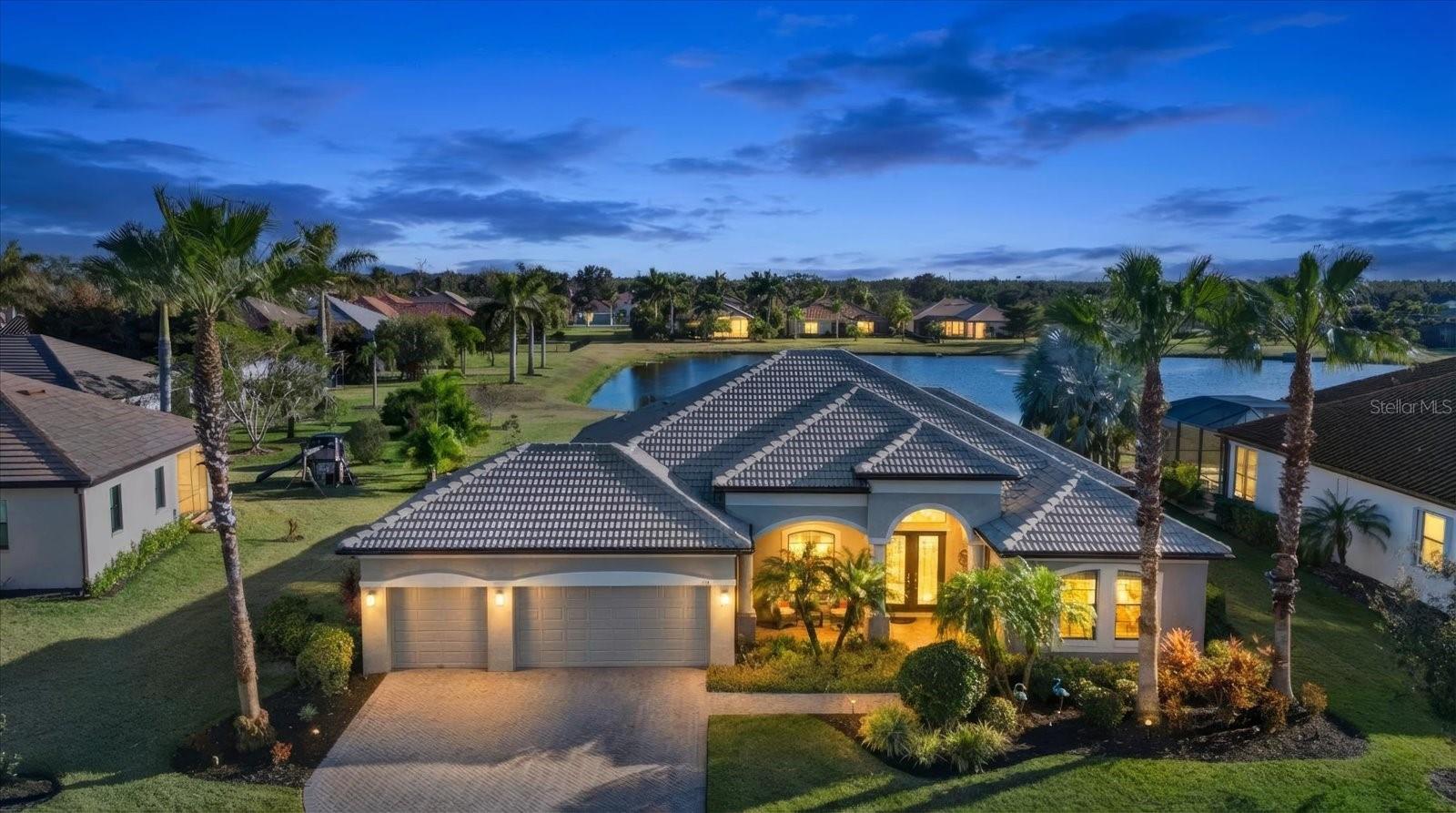 Welcome to private executive living in the exclusive, gated Enclave at Country Meadows, an intimate community of just 68 ESTATE homes. If you HATE CDD’S…then this NO-CDD, NO-FLOOD ZONE home is just for you, perfectly facing N and positioned on a premium .45 ACRE, waterfront homesite complete with timed landscape lighting. This expanded Aruba model by Medallion Homes offers exceptional upgrades throughout! Did somebody say FULL HOUSE CENTRAL VACUUM that was recently replaced (2024) WOW!!! Complete with CROWN MOLDING and TRAY ceilings and has a nice open floor plan that delivers a noticeably, more spacious feel in the living, dining, and kitchen areas, as well as in the oversized primary bedroom. ALL NEW LED lighting in the kitchen and family room. Here’s the REAL GAME CHANGER…this home boasts 2 BRAND NEW HVAC units (2025, under warranty) If you love to sleep cool, one system independently controls the primary wing, while the 2nd unit controls the remainder of the home for added comfort and efficiency. Now, that’s a real WIN-WIN!  Menopause…no problem! With 3B/3B plus a large private den/flex room OR MAYBE…even a man-cave! This 3-car garage home offers a gourmet kitchen with Cambria quartz countertops, a butler’s pantry, aquarium window in the breakfast nook, stainless steel appliances, built-in microwave, convection oven, warming drawer, NEWER quiet garbage disposal (2022) AND a 36-inch gas cooktop. A 250-gallon buried propane tank powers the cooktop, outdoor kitchen w/disposal, water heater, dryer, whole-house Kohler 20KW generator (2023) You’ll be the envy during hurricane season for sure! Oh and don’t worry, this home has the shutters for that too for those hurricane parties where you finally meet all the neighbors! The great room showcases gorgeous hardwood floors and a wall of pocketing sliding glass doors that disappear completely for that gorgeous cross-breeze and views of your very own saltwater pool that is equipped with a NEW PENTAIR POOL PUMP (2023) and NEW PENTAIR Chlorinator (2026) overlooking the pond and fountain. Step outside to a screened lanai complete with pavers, a full summer kitchen a built-in grill, gas cooktop, sink with NEW disposal (2024) a NEWER FRIDGE (2023)  for all those FUN drinks that will be had. The split-bedroom design offers privacy for guests and an indoor/outdoor bath with lanai access while the primary suite also has access to the pool area. The primary, spa-inspired bath features a soaking tub, dual vanities, a large walk-in shower, large custom built-in master walk-in closet. With southern rear exposure, you’ll enjoy sun-filled pool days and stunning Florida sunsets over the water in Florida… where the only thing we ice, are our margaritas! Additional highlights include private well irrigation, gutters/downspouts, over-sized paver driveway and walkway, cute front porch, recent outdoor paint (2026) and countless thoughtful upgrades throughout. Close to famous FL beaches, shopping restaurants galore, great schools and so much more! This one is a complete MUST-SEE! Book your private showing today!