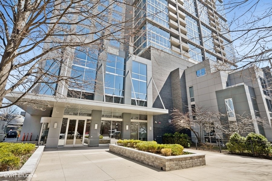 Enjoy breathtaking lake and skyline views from this beautifully updated 2BD + Den / 2BA condo in Harbor View-one of South Loop's most sought  after full amenity buildings. Spanning approx. 1,200 sq ft, this sun-drenched home features floor-to-ceiling windows, brand-new hardwood floors in the living area, and brand-new carpet in the bedrooms. The open layout is perfect for modern living. The updated kitchen includes granite countertops, newer SS appliances, and a breakfast bar. The spacious primary suite includes a large walk-in closet upgraded with a Container Store ELFA system and a spa-like bath with double vanity and European shower. A second large bedroom, versatile den/office, second full bath, and in-unit laundry complete the home. Enjoy luxury amenities including a rooftop pool with cabanas, fitness center, sauna, party room, and dog run. Steps from the lakefront, Museum Campus, Wintrust Arena, Women's Park, and Green Line.
