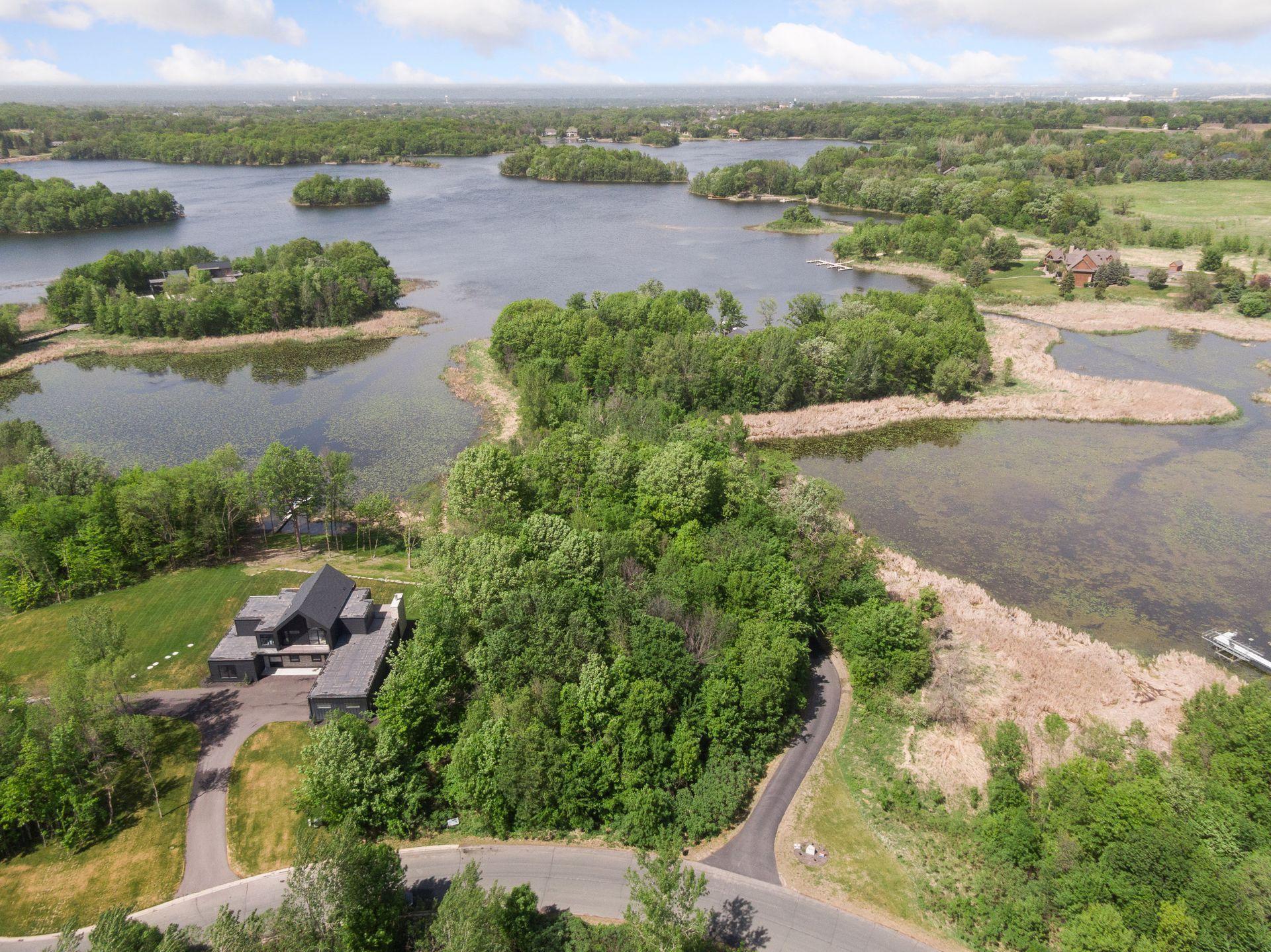 Remarkable opportunity to design and build a dream home at The Peninsula at Lake O'Dowd development. Featuring 14 heavily wooded homesites, The Peninsula offers the perfect combination of privacy on a fully recreational lake along with stunning luxury homes. This lot features 804 feet of lakeshore along with options for installing a dock on either the west or east side of the lot. Depending upon the final design of the home, there's a possibility for a lookout or walkout lower level.