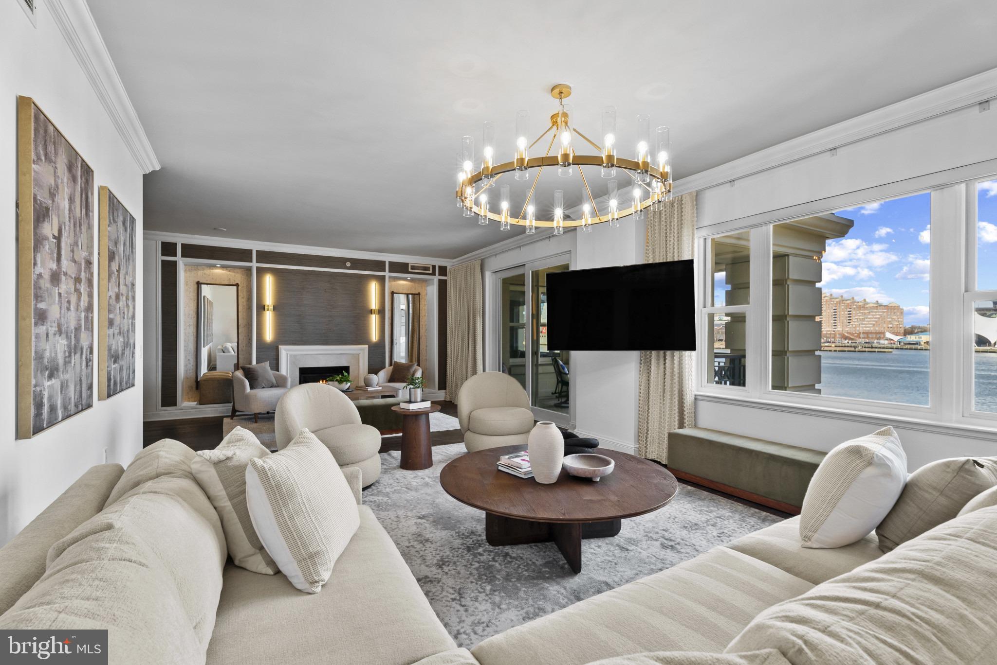 Experience unparalleled elegance at Baltimore’s prestigious waterfront community. Enter directly from the elevator into this expansive two-bedroom, two-full-bathroom, and one-half-bathroom residence which offers over 2,775 square feet of sophisticated living space, highlighted by beautiful finishes and stunning views of the pristine garden and Baltimore’s Inner Harbor. The open-concept design seamlessly blends style and functionality, with a comfortable family room off the kitchen, an elegant living room centered around the gas fireplace, and a show-stopping dining area featuring a magnificent table — perfect for hosting unforgettable gatherings. Every detail has been thoughtfully curated, from the rich designer hardwoods to the chef-inspired kitchen with Viking stainless steel appliances and custom cabinetry. The spacious primary suite boasts a luxurious spa bath and one incredible walk-in closet. Step onto your private balcony to take in the picturesque views, or unwind in your private community garden before stepping directly onto the Baltimore Promenade to hop on the water taxi or take a scenic stroll. The building’s world-class amenities include 24/7 concierge and security, valet parking, a doorman, porter service, pristine gardens, an indoor pool, a fitness center, a community theater, six guest suites, and three elegant event spaces. Minutes away from Baltimore’s vibrant arts district, as well as Ravens and Orioles games and with convenient access to BWI, I-95 South, and Penn Station, this residence provides the perfect blend of luxury, comfort, and accessibility. Discover waterfront living at its finest at The Ritz-Carlton Residences.
