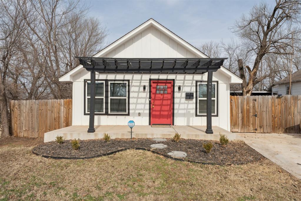 Super cute, super affordable, and perfectly located with convenient access to downtown Oklahoma City, major highways, shopping, and more — this charming newly constructed 3-bedroom, 2-bath home is everything you’ve been waiting for! Whether you’re a young family just getting started, an investor, or someone ready to downsize without sacrificing style, this home checks all the boxes. A charming front porch and inviting red door welcomes you home to a bright, stylish, modern floorplan filled with beautiful wood flooring, big windows, and custom recessed lighting that creates a light, airy feel throughout. You will love the open-concept kitchen, featuring a large island for prep and seating space, complemented by a deep farmhouse sink, stylish floating shelves, matching stainless steel appliances, and crisp white kitchen cabinetry! Retreat to the spacious primary bedroom and ensuite bath featuring custom flooring, a large walk-in closet, a modern vanity and a gorgeous refurbished tile shower! The secondary bedrooms are generously sized with big closets, offering flexibility for kids, guests, or a home office. The guest bathroom truly stands out with eye-catching floating shelves and a massive subway tile shower. A private laundry/utility room adds convenience and extra storage space. Step outside to a large backyard with an open patio and peaceful greenbelt views — the perfect setting for pets, playtime, or relaxing evenings outdoors. This modern contemporary dream delivers the perfect blend of cute, affordable, and move-in ready. Don’t miss your chance to make it yours — schedule your private showing today!