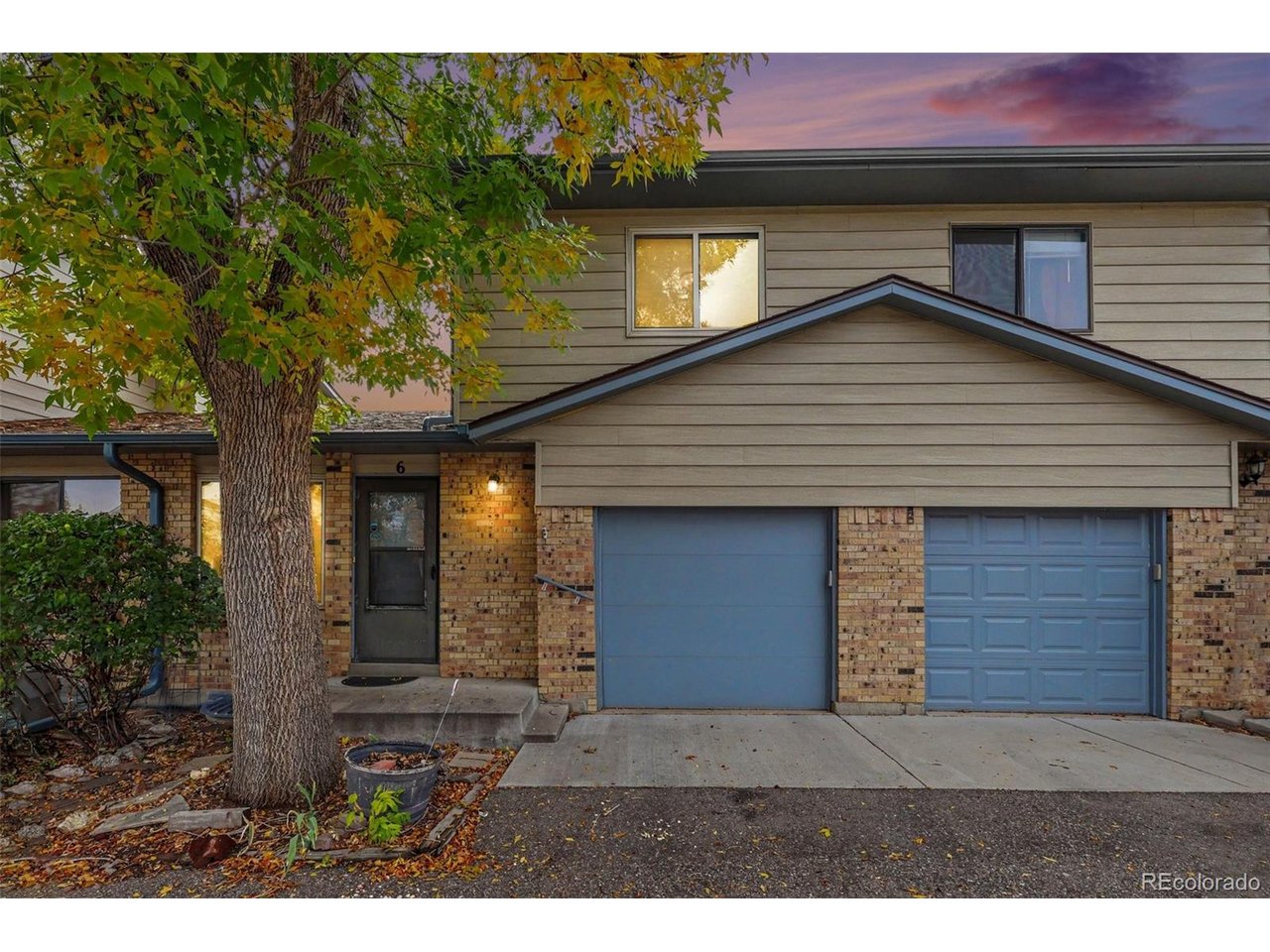 An affordable, move-in ready opportunity to own in desirable Arvada without sacrificing space, outdoor living, or garage parking! This charming 2 bed, 3 bath townhome offers 979 finished square feet across two stories, plus a versatile walk-out basement that extends your living and storage potential far beyond its finished footprint. The updated main level boasts low-maintenance LVP flooring, a bright living and dining area, a half bath, and a updated kitchen featuring sleek stone countertops. Step directly out from the kitchen onto a large, south-facing deck ideal for entertaining. ,The main level also connects with direct interior access to your attached 1-car garage. Upstairs features two comfortable bedrooms and a full bath with a refinished tub. The lower level offers an expansive basement equipped with laundry, an additional half bath, and flexible bonus space perfect for hobbies, a gym, or extra storage, leading directly out to a private, fenced outdoor patio space. Nestled in a peaceful community with an exceptionally low $244 monthly HOA, you are just moments away from park green space, playgrounds, fishing, and the Interurban Trail, while remaining minutes from vibrant Historic Olde Town Arvada's popular dining, breweries, community events, and easy commuting via the RTD G Line.
